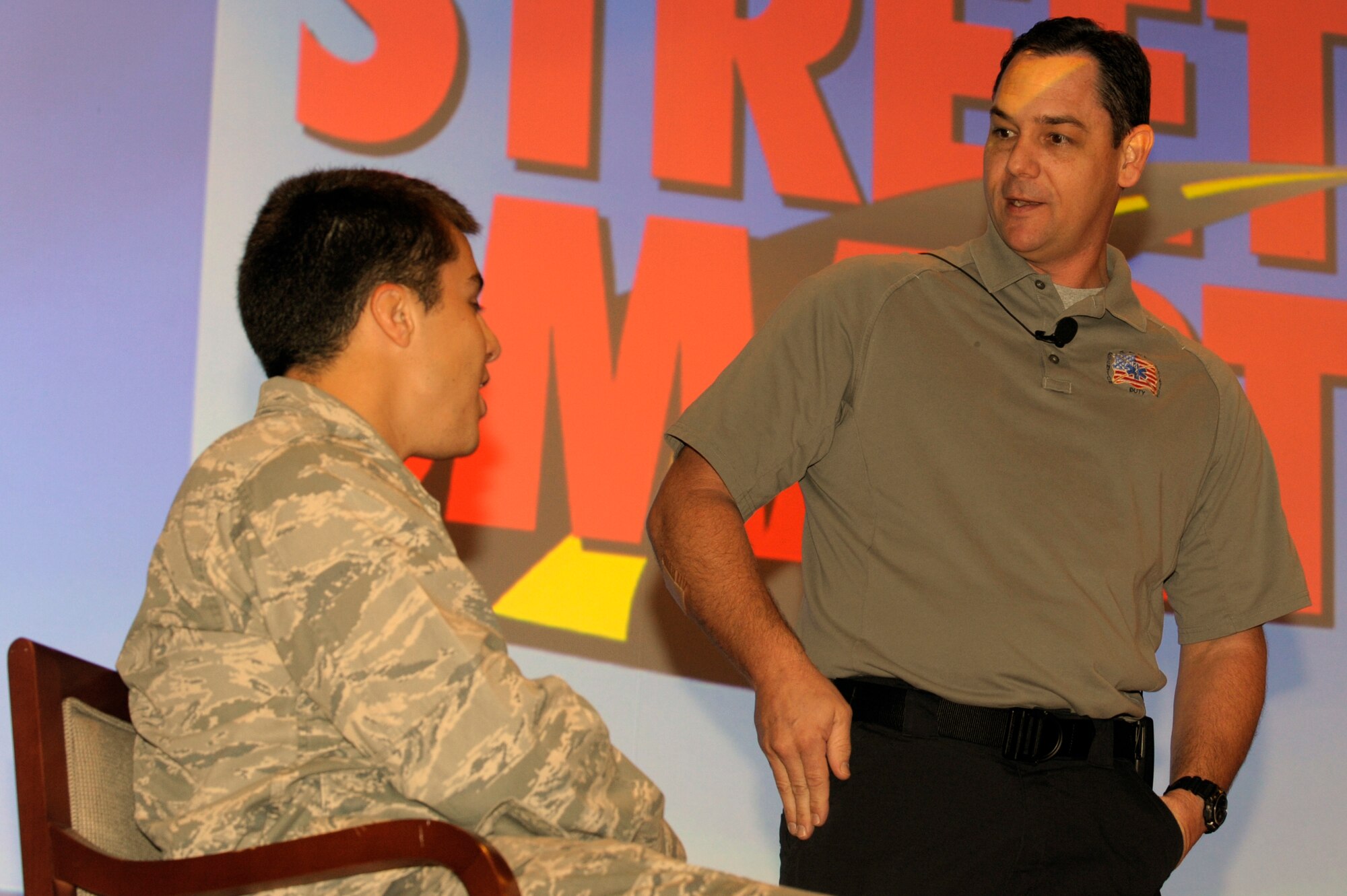 VANDENBERG AIR FORCE BASE, Calif. -- Scott Neusch, an Orlando, Fla., firefighter, sets up an accident scenario with 2nd Lt. Felix Abeytta, 1st Air and Space Test Squadron, here Wednesday, Nov. 30, 2011. The Street Smart presentation is part of a national program created by Florida Stay Alive From Education in 1988 to help reduce the occurrence of drinking and driving. 
 (U.S. Air Force photo/Jerry E. Clemens, Jr.)