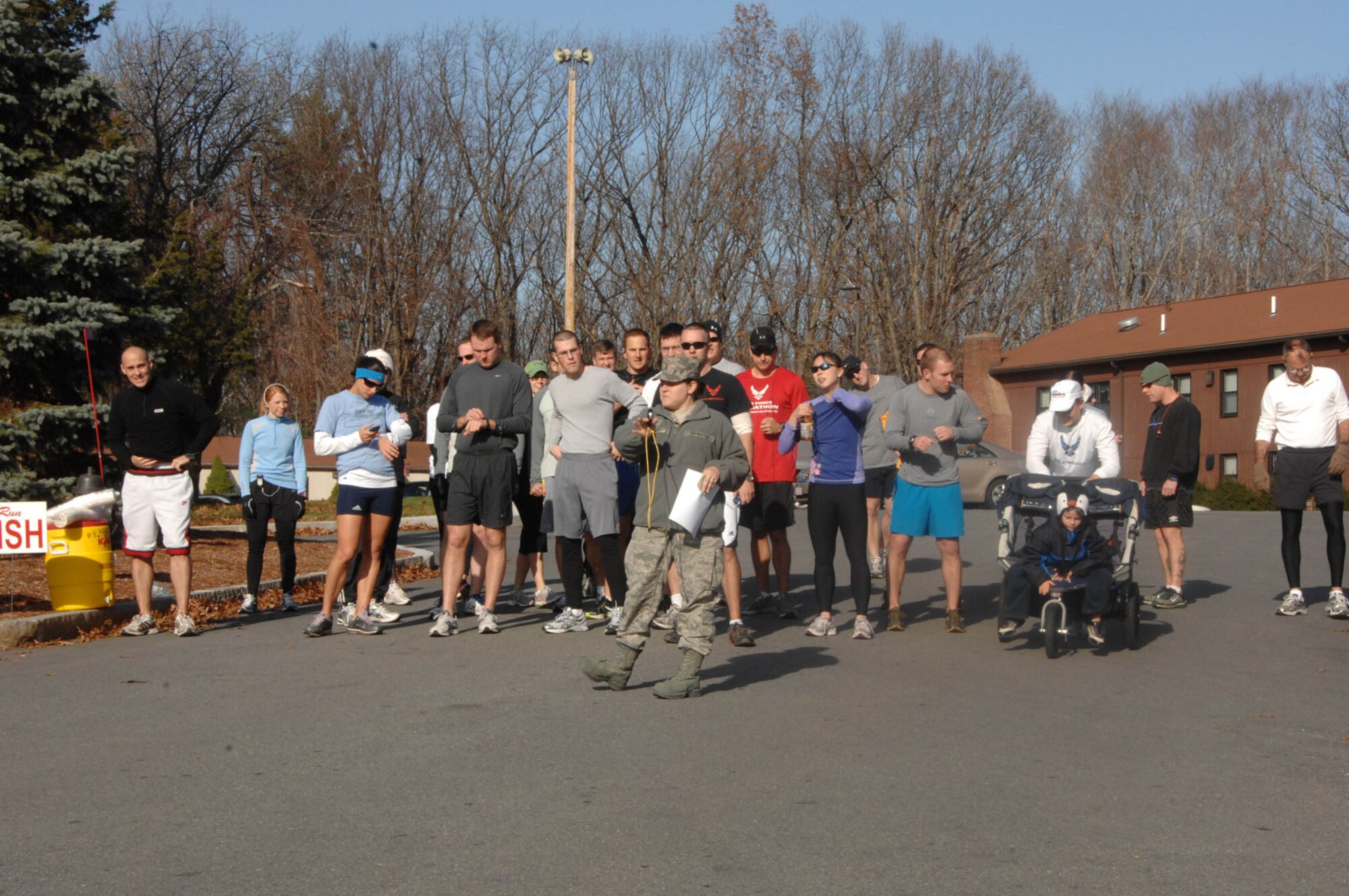 HANSCOM AIR FORCE BASE, Mass. – 1st Lt. Jessica Zencey (front), Combined Federal Campaign installation manager, gives instructions to runners before the start of the CFC 10K fun run Nov. 22 at the Minuteman Commons. Participants donated $10 to race and received three tickets to use toward the CFC chili cook-off. Money raised went to the American Heart Association, Children's Heart Foundation, Heart Disease Research Institute, Vascular Disease Foundation and Little Hearts for Little Tots. (U.S. Air Force photo by Linda LaBonte Britt)