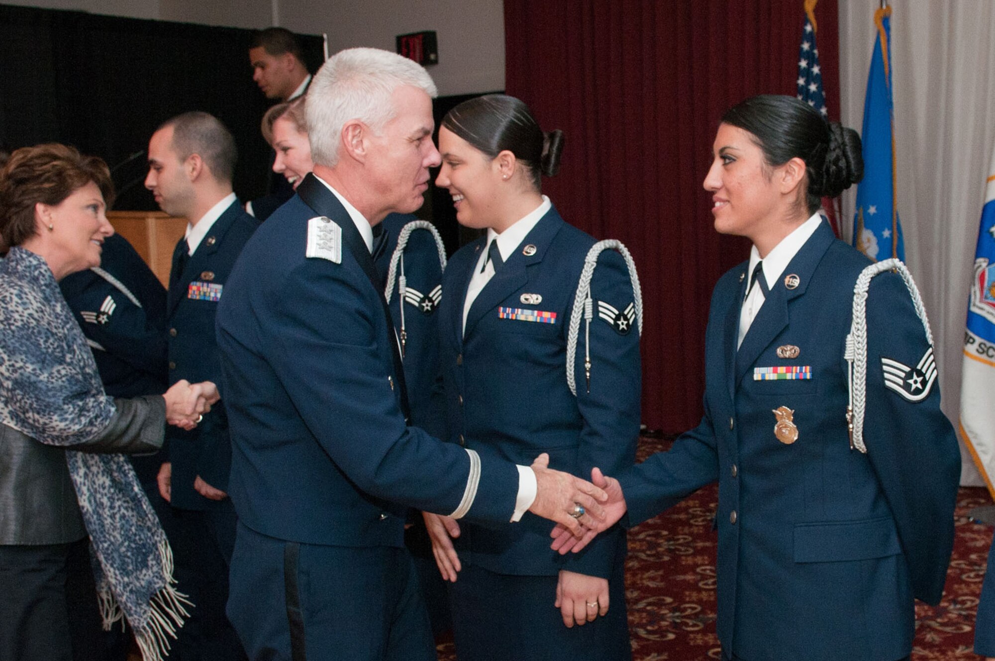 HANSCOM AIR FORCE BASE, Mass. – Lt. Gen. CR Davis, Electronic Systems Center commander, congratulates Staff Sgt. Nicole Barajas (right), Airman Leadership School Class 12A John L. Levitow award recipient, during ALS graduation Nov. 18 at the Minuteman Commons. Ten Airmen took the next step in their professional military education journey during the graduation. (U.S. Air Force photo by Rick Berry)