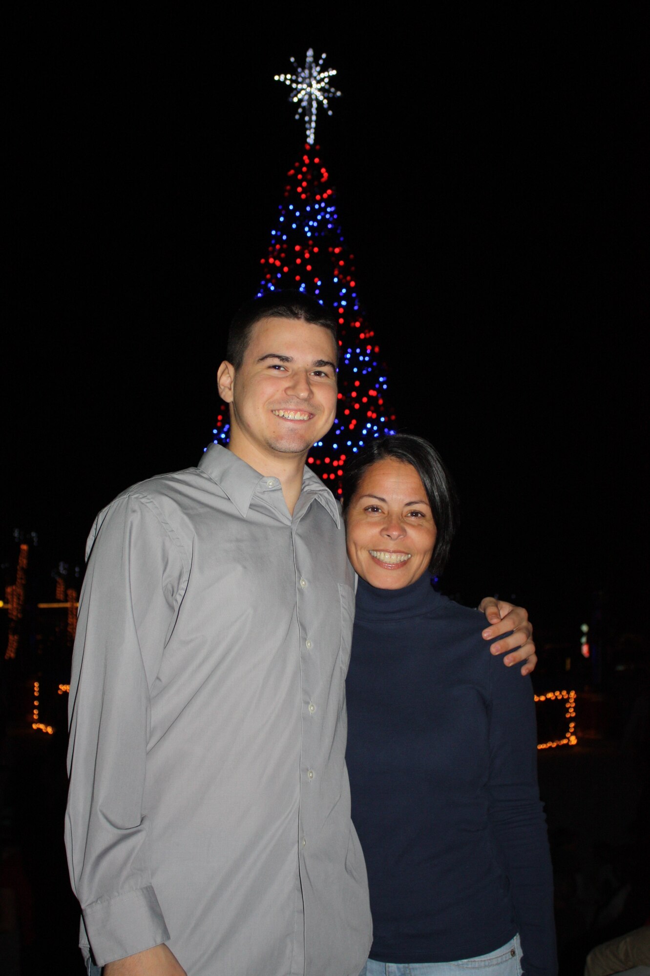 U.S. Air Force Airman 1st Class Joshua Heath, 23rd Aircraft Maintenance Squadron avionics specialist, poses with family friend "Puchi" Orta after Thanksgiving dinner near Eustis, Fla., Nov. 24, 2011. Orta's husband and Heath's father were stationed together near Stuttgart, West Germany, in the '80s. (Contributed photo)