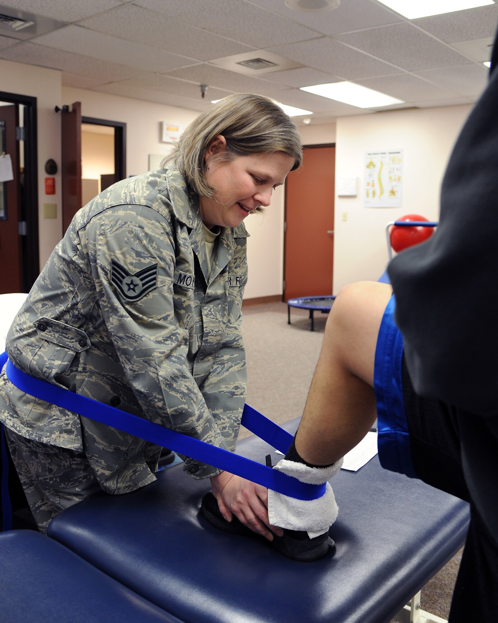U.S. Air Force Staff Sgt. Meghan Moylan provides physical therapy to a patient Nov. 16, 2011, Eielson Air Force Base, Alaska. Moylan is the 354th Medical Group NCO-in-charge of physical therapy. (U.S. Air Force photo/Senior Airman Willard Grande II)