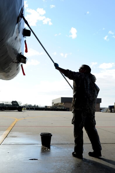 Senior Airman David Nichols uses a scrubber to wash the side of an F-15E Strike Eagle during an aircraft wash on Seymour Johnson Air Force Base, N.C., Nov. 28, 2011. During a jet's washing, Airmen clean the inside of the canopy and the outside of the jet to prevent dirt and corrosion build up. Each jet is washed biannually to aid in the aircraft's longevity. Nichols is a 4th Aircraft Maintenance Squadron crew chief from Hayward, Wis.  (U.S. Air Force photo by Senior Airman Whitney Stanfield)