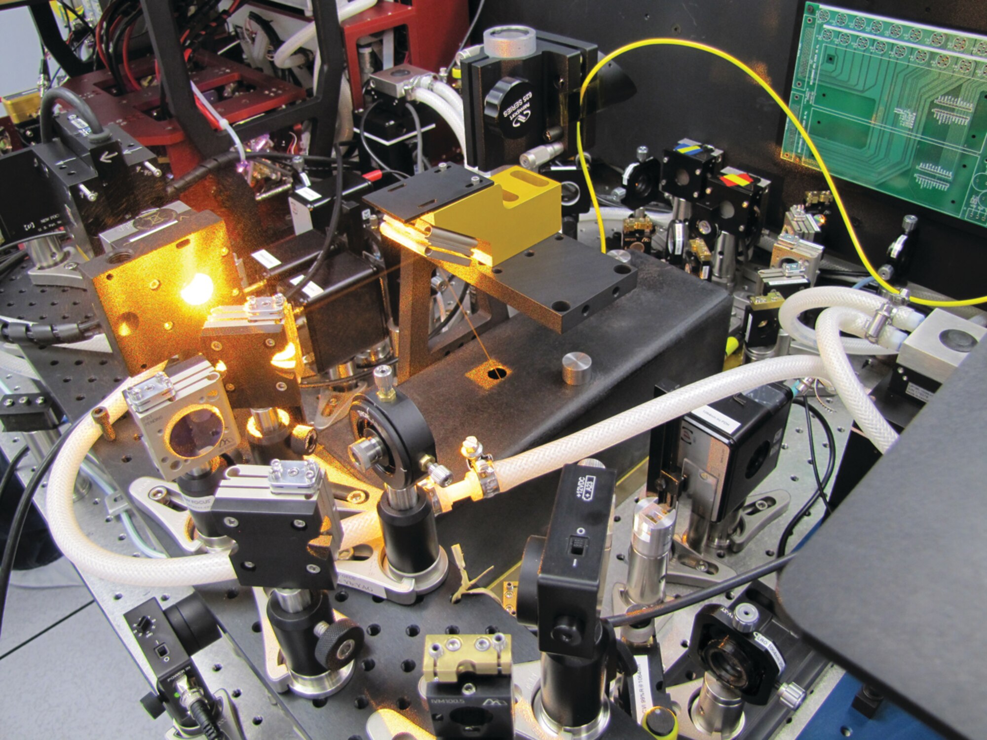 Resonant 'bowtie' Frequency Addition Source of Optical Radiation (FASOR) cavity, achieving 55W, which ensures adequate system performance during more nights of the year. The exiting port carries 55W of power with near perfect beam quality.  (AFRL Image)