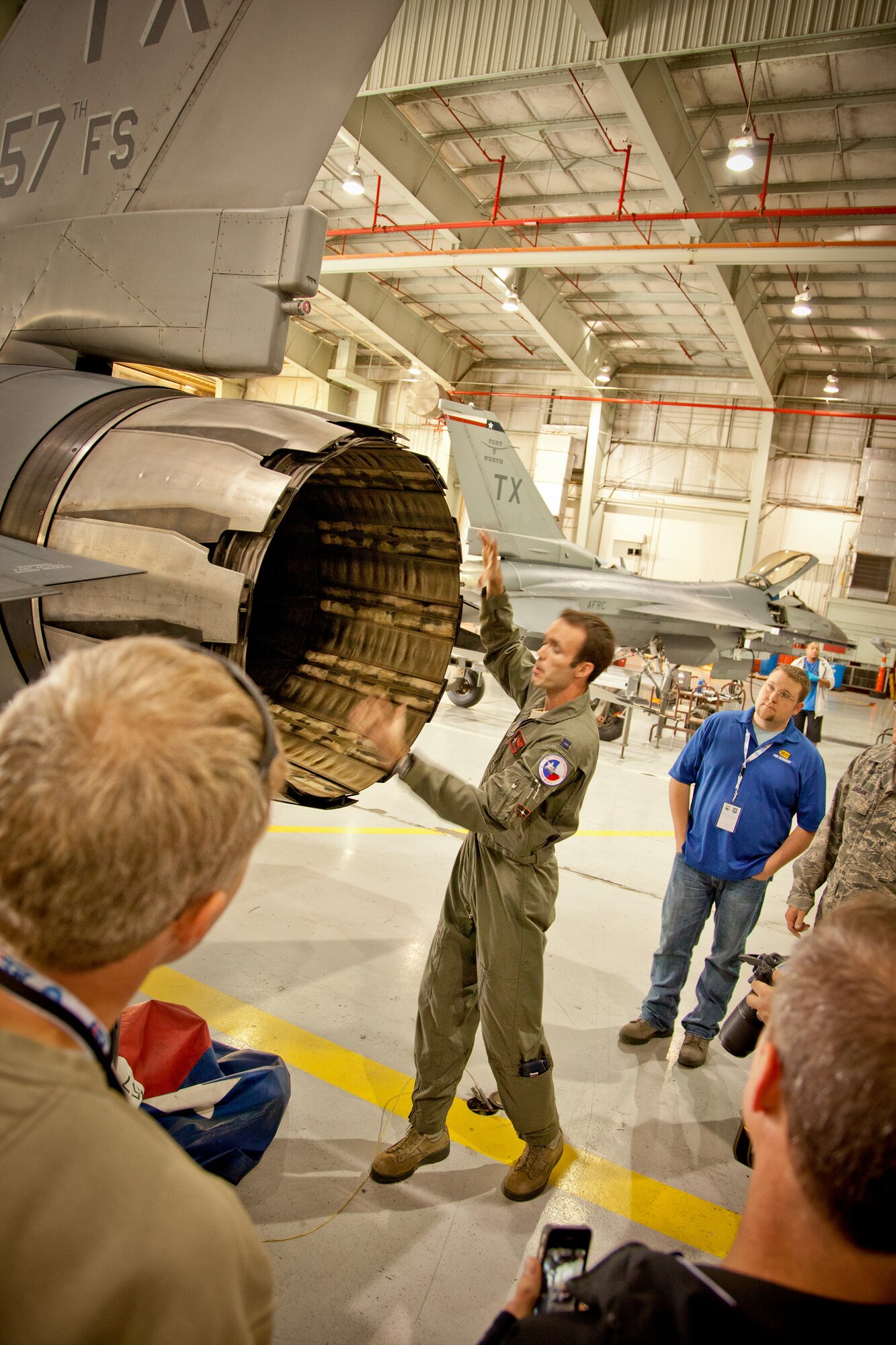 A Marine Captain answers questions from the civil leaders about the F-16 Fighting Falcon aircraft at the 934th Airlift Wing Civic Leader Tour, Fort Worth, Texas.  (Air Force Photo/Shannon McKay)
