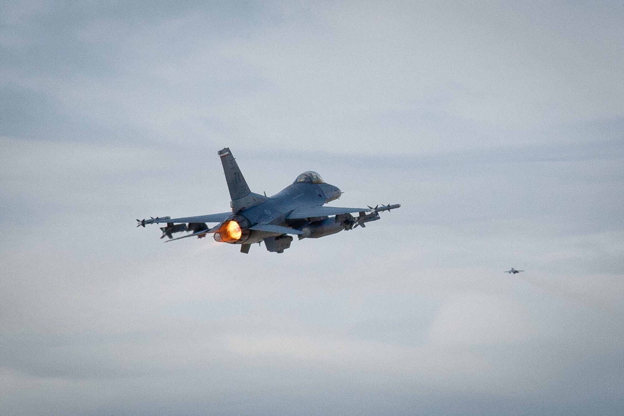 An F-16 Fighting Falcon hits it's afterburner as it takes off from Naval Air Station and Joint Reserve Base Fort Worth as part of a demonstration during the 2011 934th Airlift Wing Civic Leader Tour.  (Air Force Photo/Shannon McKay)
