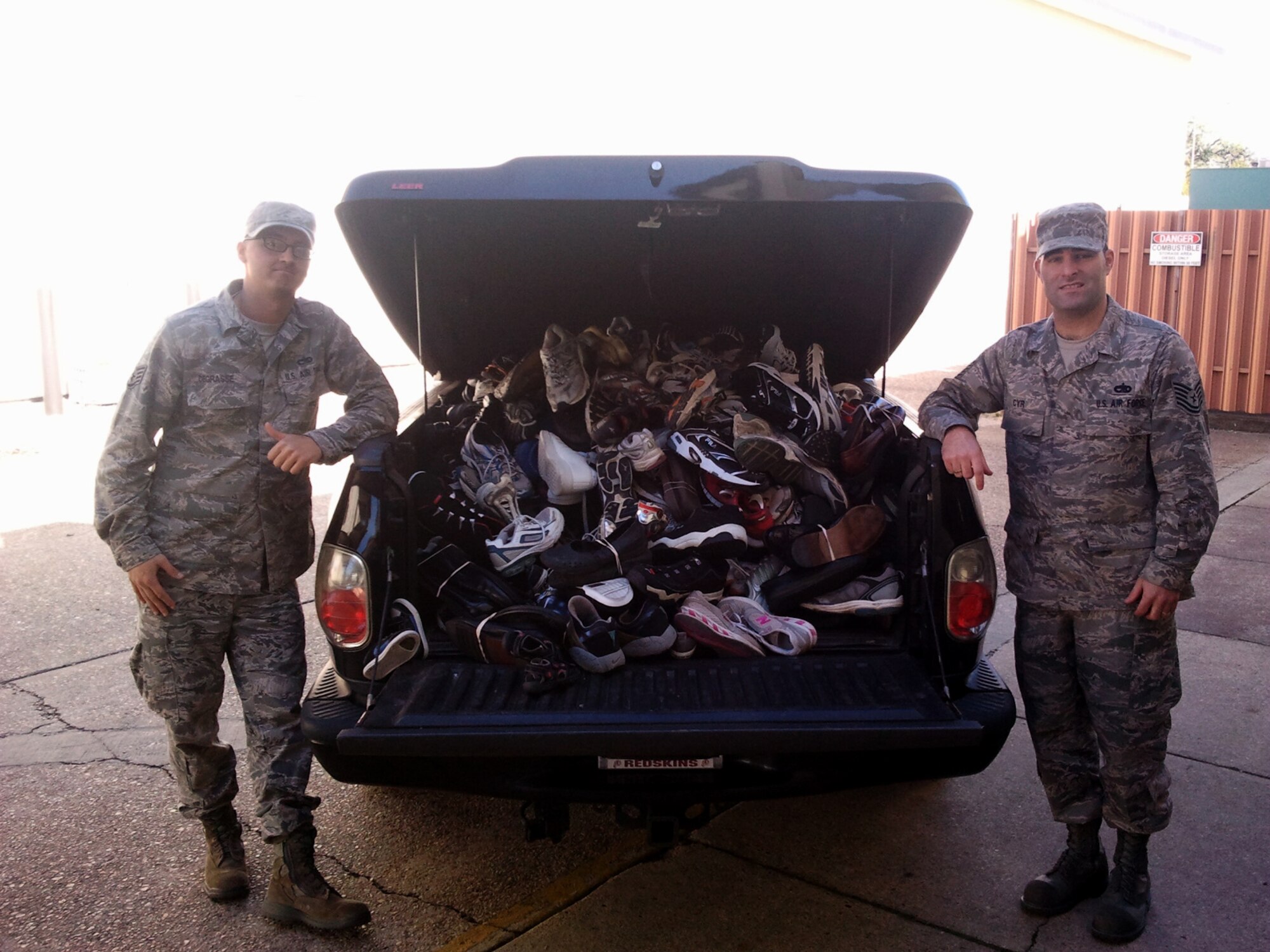 Staff Sgt. Jason DeGrasse and Tech. Sgt. Nathan Cyr, 335th Training Squadron metrology instructors, prepare to deliver shoe donations to a local running and triathlon store to forward for the nonprofit Perpetual Prosperity Pumps Foundation campaign.  With help from members of their own squadron as well as volunteers from the 336th TRS, 85th Engineering Installation Squadron and Keesler’s Center for
Naval Aviation Technical Training Unit, Cyr and DeGrasse collected 219 pairs of shoes, 38 pairs of boots and 25 pairs of sandals.  (Courtesy photo by Theodore Rayon)