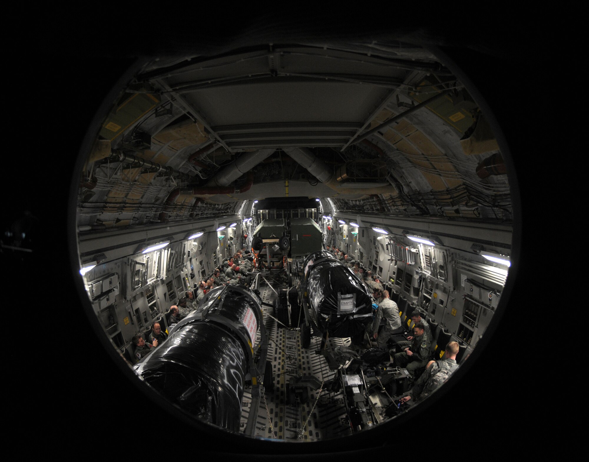 ROYAL AIR FORCE LAKENHEATH, England - Airmen from the 48th Fighter Wing and members of the Heavy Airlift Wing, Papa Air Base, Hungary, prepare to deploy in support of Operation Odyssey Dawn, March 19, 2011. Members of the 48th Fighter Wing were recently notified that they would be supporting efforts in Operation Odyssey Dawn.  The 48th FW provides all-weather, day or night air superiority and air-to-ground precision combat capability as well as combat search and rescue capabilities. (U.S. Air Force photo by Airman Cory D. Payne)