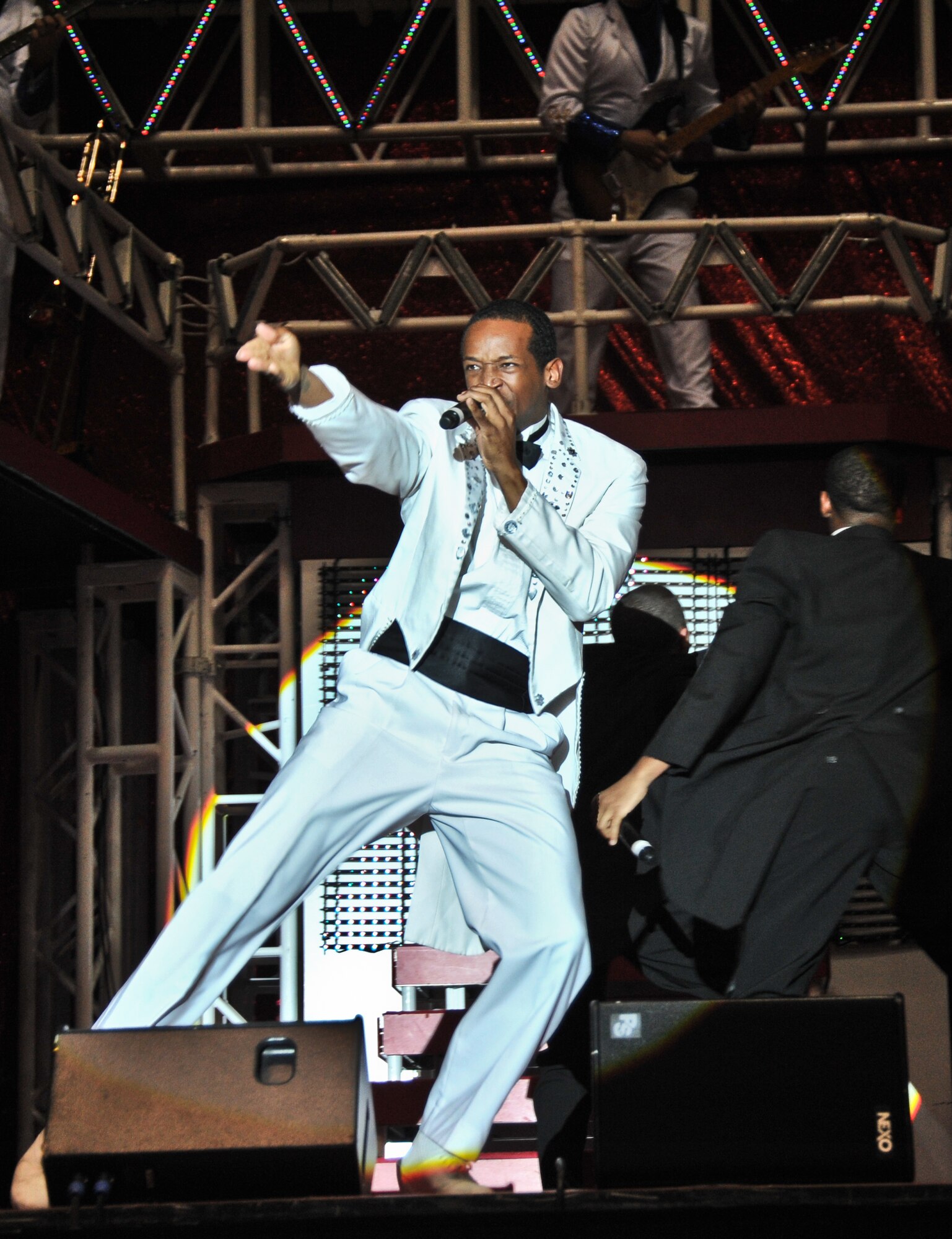 Staff Sgt. Quentin Thomas, Tops in Blue vocalist, performs during their “Rhythm Nation” tour Nov. 29 at the University of Guam Field House in Mangilao, Guam. Tops in Blue serves as an expeditionary entertainment unit and provides quality entertainment for the Air Force family while simultaneously promoting community relations, supporting recruiting efforts, and serving as ambassadors for the Unites States and the U.S. Air Force. (U.S. Air Force photo by Staff Sgt. Alexandre Montes/released)