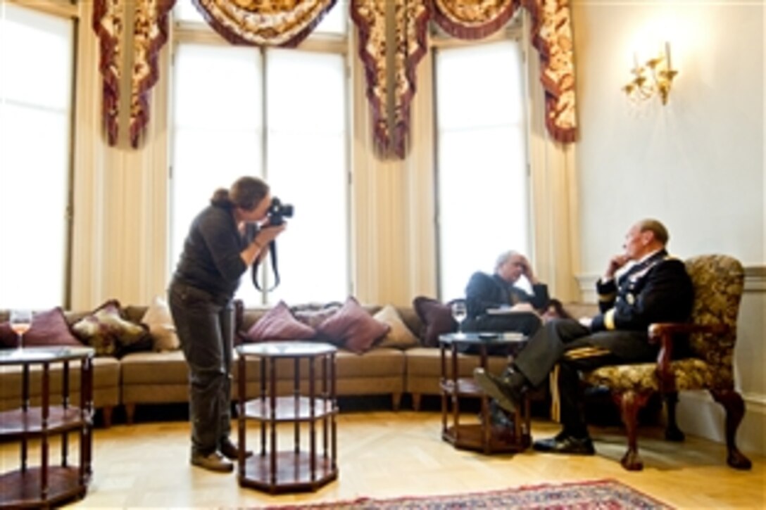 Journalists from the Financial Times interview and photograph U.S. Army Gen. Martin E. Dempsey, chairman of the Joint Chiefs of Staff, in London, Nov. 29, 2011.