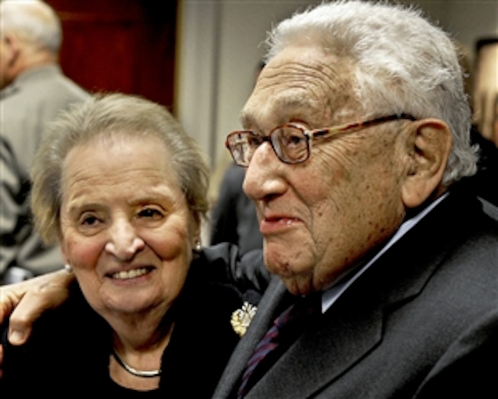 Former Secretaries of State Madeleine Albright and Henry A. Kissinger embrace before sitting down to a meeting of the Defense Policy Board at the Pentagon, Nov. 30, 2011. The board provides the defense secretary and senior staff with independent, expert analysis, recommendations and opinions regarding security policy issues.