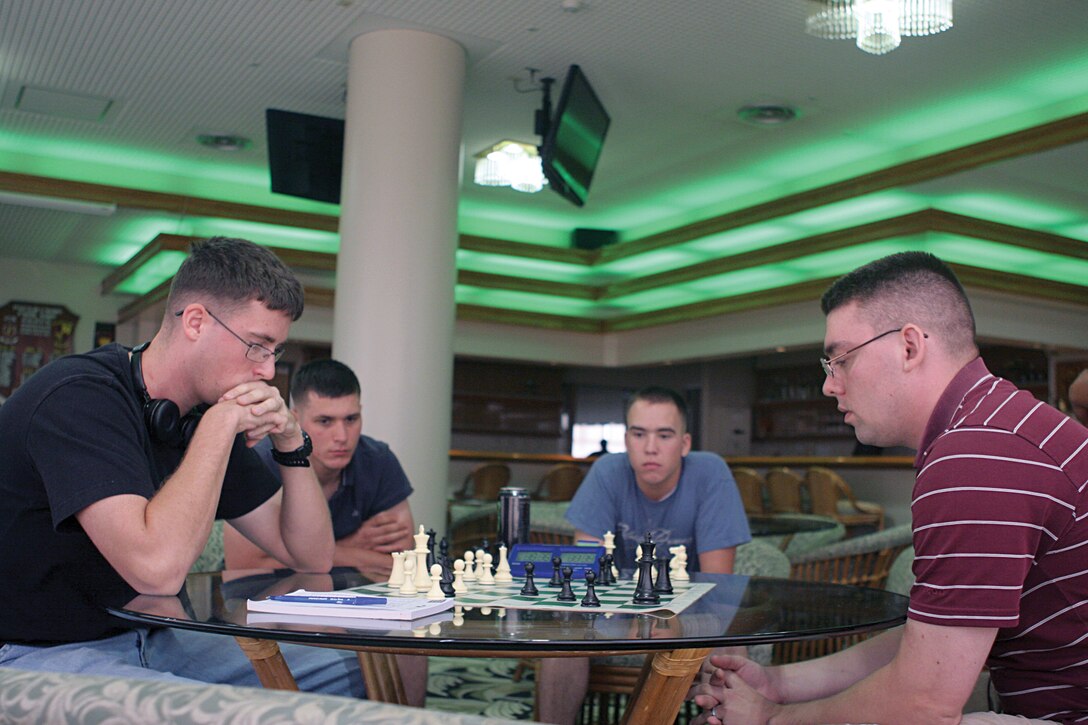 Participants face off during a chess and Texas Hold’em tournament at The Palms Club on Camp Hansen Oct. 1. “Hosting tournaments like this is one of the ways that we look to help Marines stay entertained,” said Alexander F. Demitras, club operations assistant with The Palms Club.