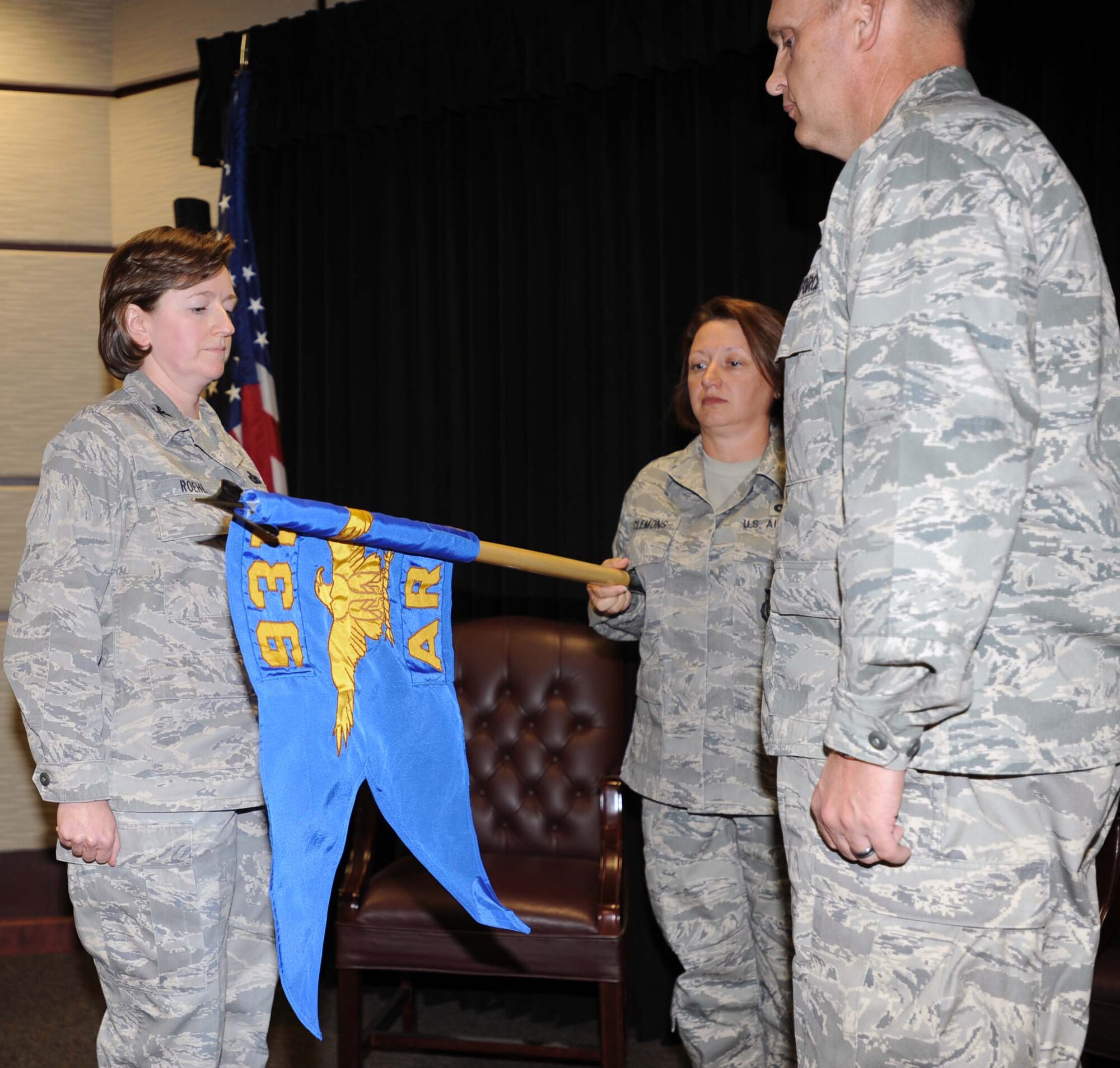 Col. Mary Roehl, Air Force Reserve Command Chief of Security Forces, and Col. William H. Mason, Commander, 931st Air Refueling Group, look on as the 931st Security Forces Squadron guidon is unfurled during a unit activation ceremony at McConnell Air Force Base, Kan., Oct. 1.  The 931st Security Forces Squadron was officially activated during the ceremony.  (U.S. Air Force photo by 1st Lt. Zach Anderson)