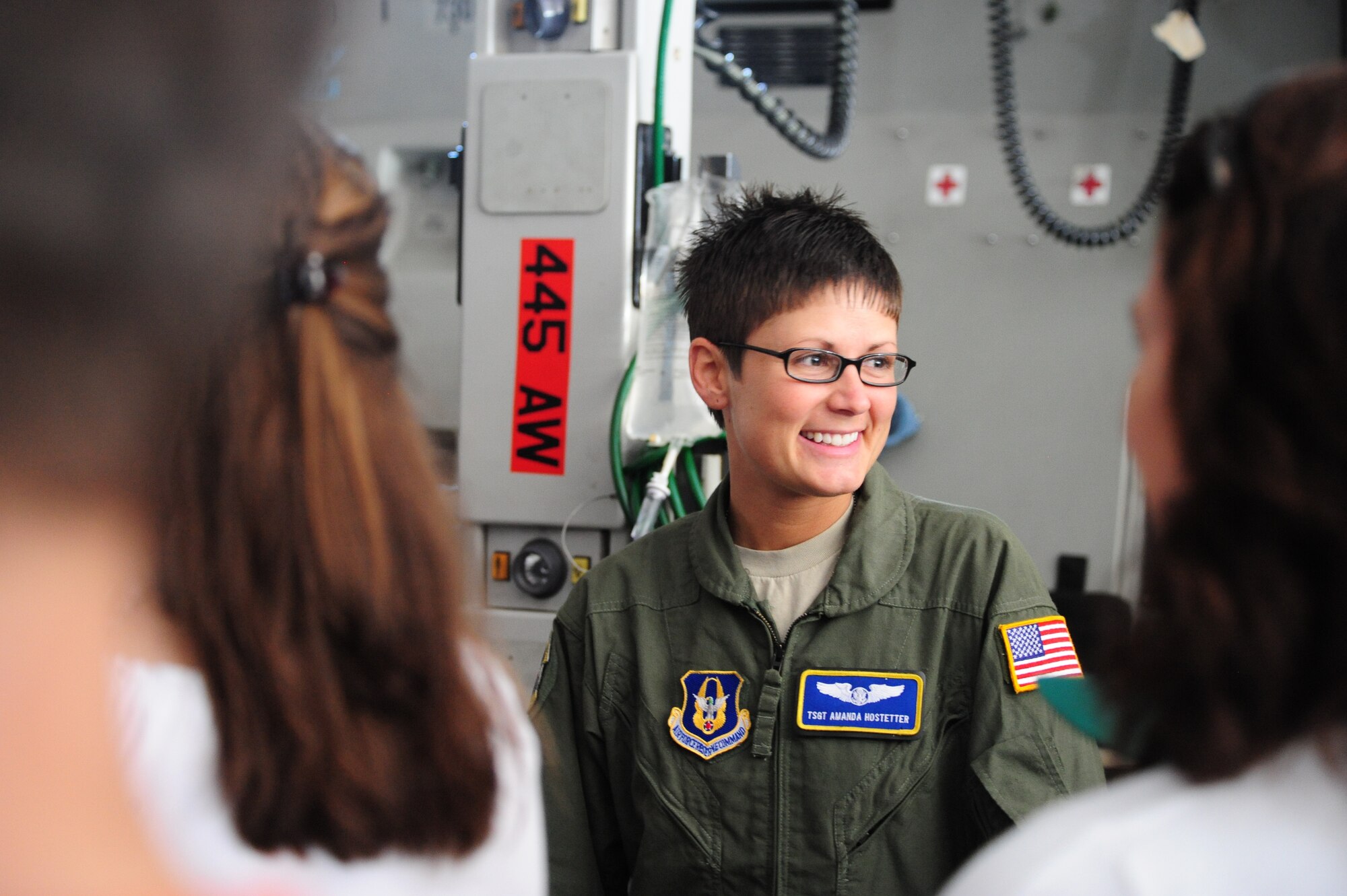PRETORIA, South Africa - Tech. Sgt. Amanda Hostetter, 445th Aeromedical Evacuation Squadron aeromedical technician from Wright Patterson Air Force Base, Ohio, interacts with visitors aboard the C-17 during the 2011 Air Show & Lifestyle Expo at Waterkloof Air Force Base, Oct. 1. More than 50,000 South Africans visited the base for the air show. (U.S. Air Force photo by Tech. Sgt. Todd Wivell)