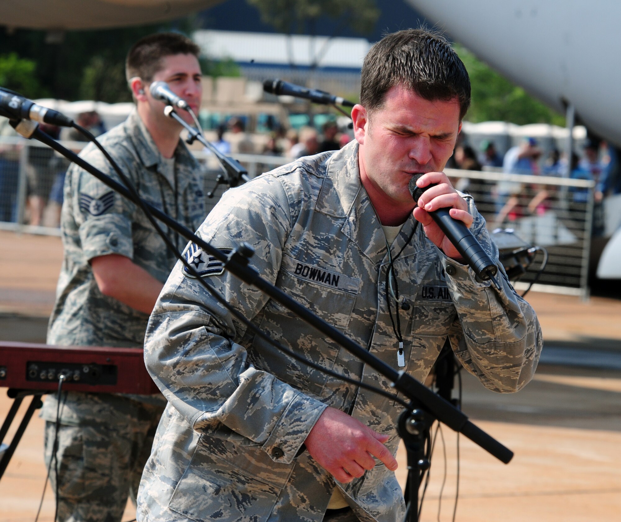 PRETORIA, South Africa - Staff Sgt. Craig Bowman, U.S. Air Forces Europe Band “Top ‘n Go” lead singer, performs a song during the 2011 Air Show & Lifestyle Expo at Waterkloof Air Force Base, Oct. 1. The six-person band has been traveling and performing all over the Pretoria area since their arrival last week. (U.S. Air Force photo by Tech. Sgt. Todd Wivell)