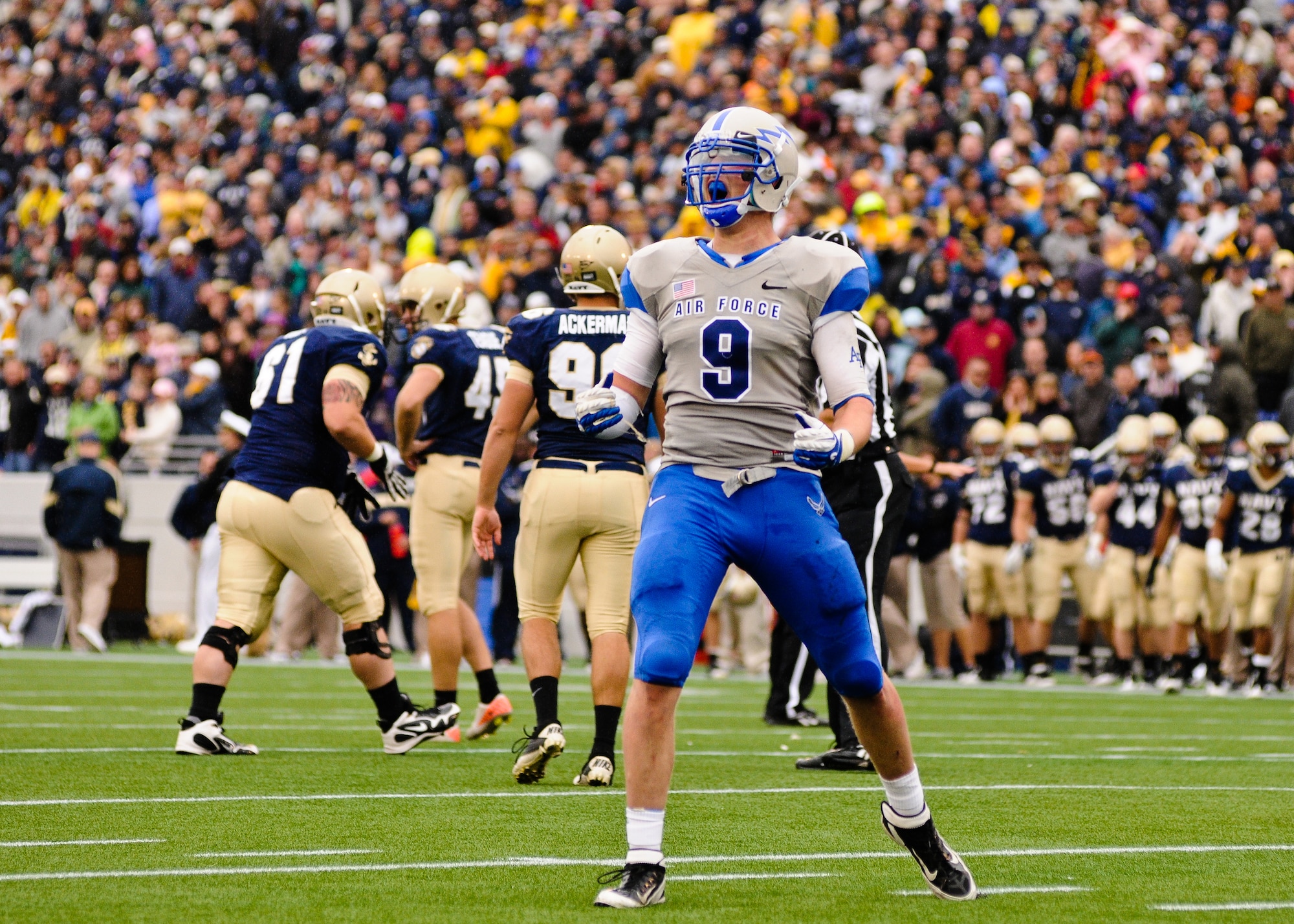 Air Force linebacker Alex Means celebrates after blocking the game winning point-after attempt as the Falcons take on the Midshipmen of Navy Saturday, Oct. 1, 2011 at the Naval Academy's Jack Stephens Field. The Falcons dominated the first half, but almost let go of the game in the second after the Mids outscored them 25-7. The Falcons won 35-34 in overtime after Means' block of Mids kicker Jon Teague point-after attempt. (U.S. Air Force photo/Russ Scalf) 