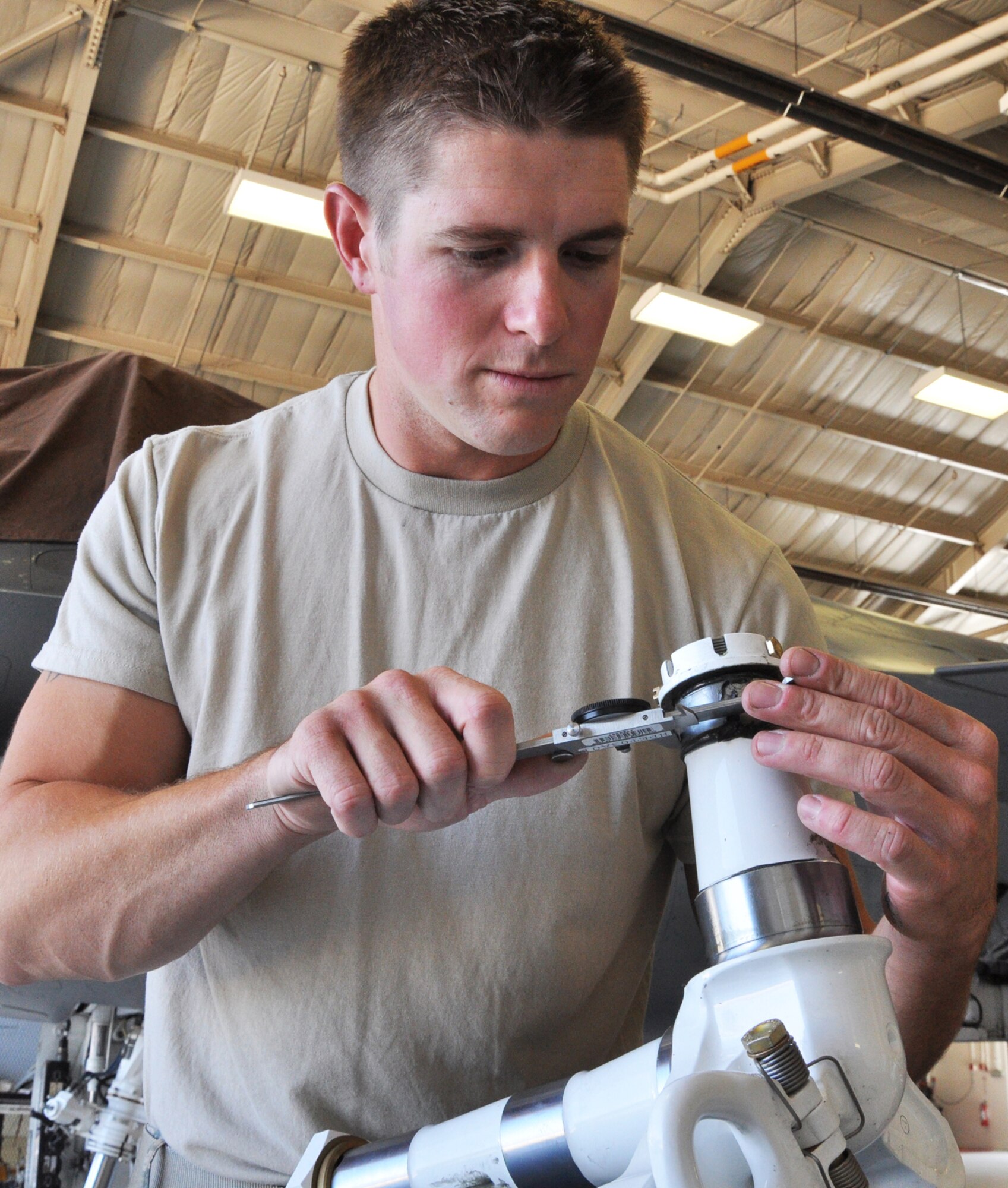 Tech. Sgt. Robert Scheifl, 419th Maintenance Squadron, fixes parts of the F-16 landing gear. (U.S. Air Force photo/Airman 1st Class Crystal Charriere)
