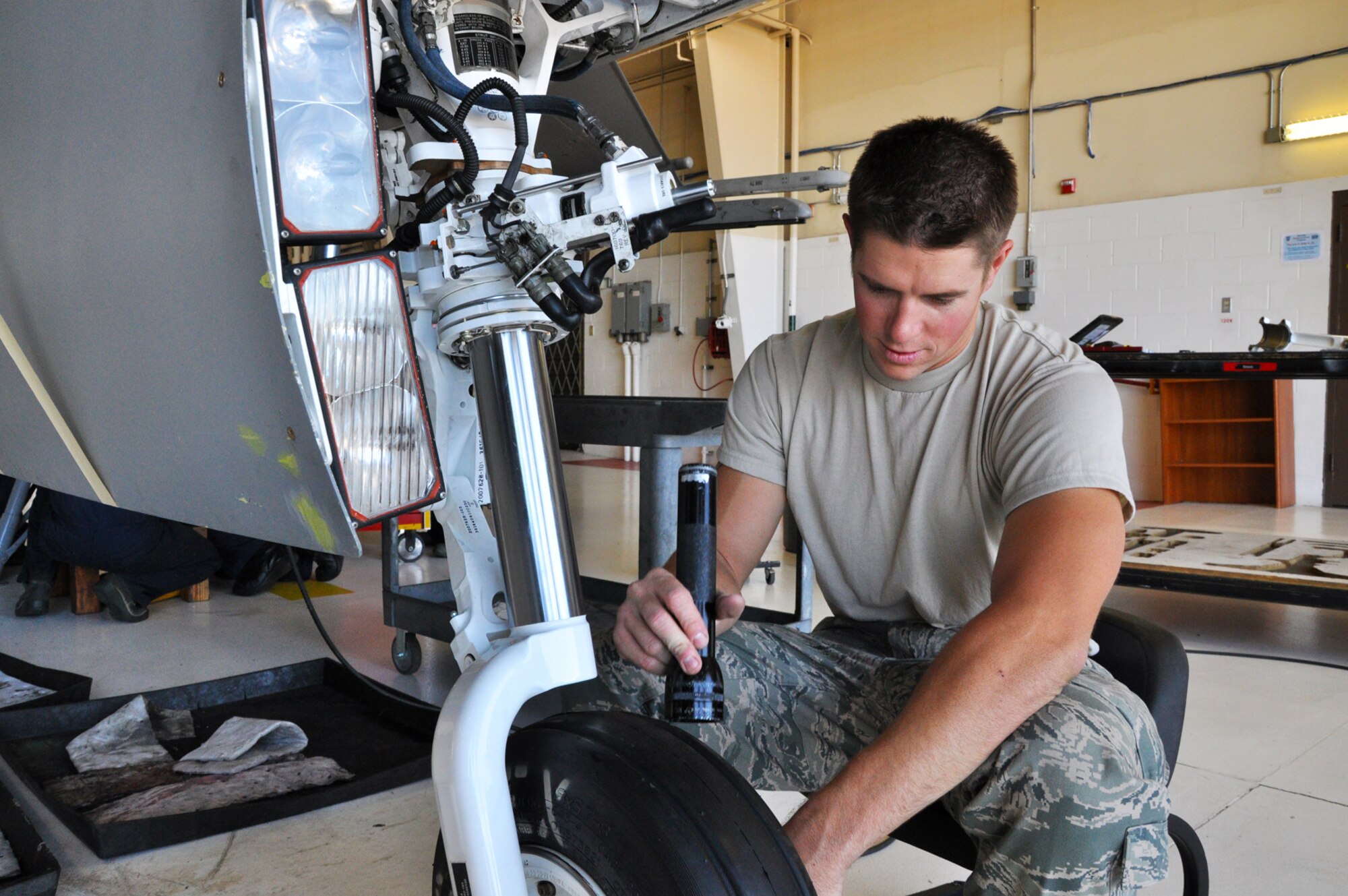 Tech. Sgt. Robert Scheifl, 419th Maintenance Squadron inspection technician, double-checks the fixes made to F-16 landing gear. Scheifl says that since he’s been named the Air Force Reserve Command’s Crew Chief of the Year for 2010, he has double-checked his work even more now that everyone is watching him closer. (U.S. Air Force photo/Airman 1st Class Crystal Charriere)