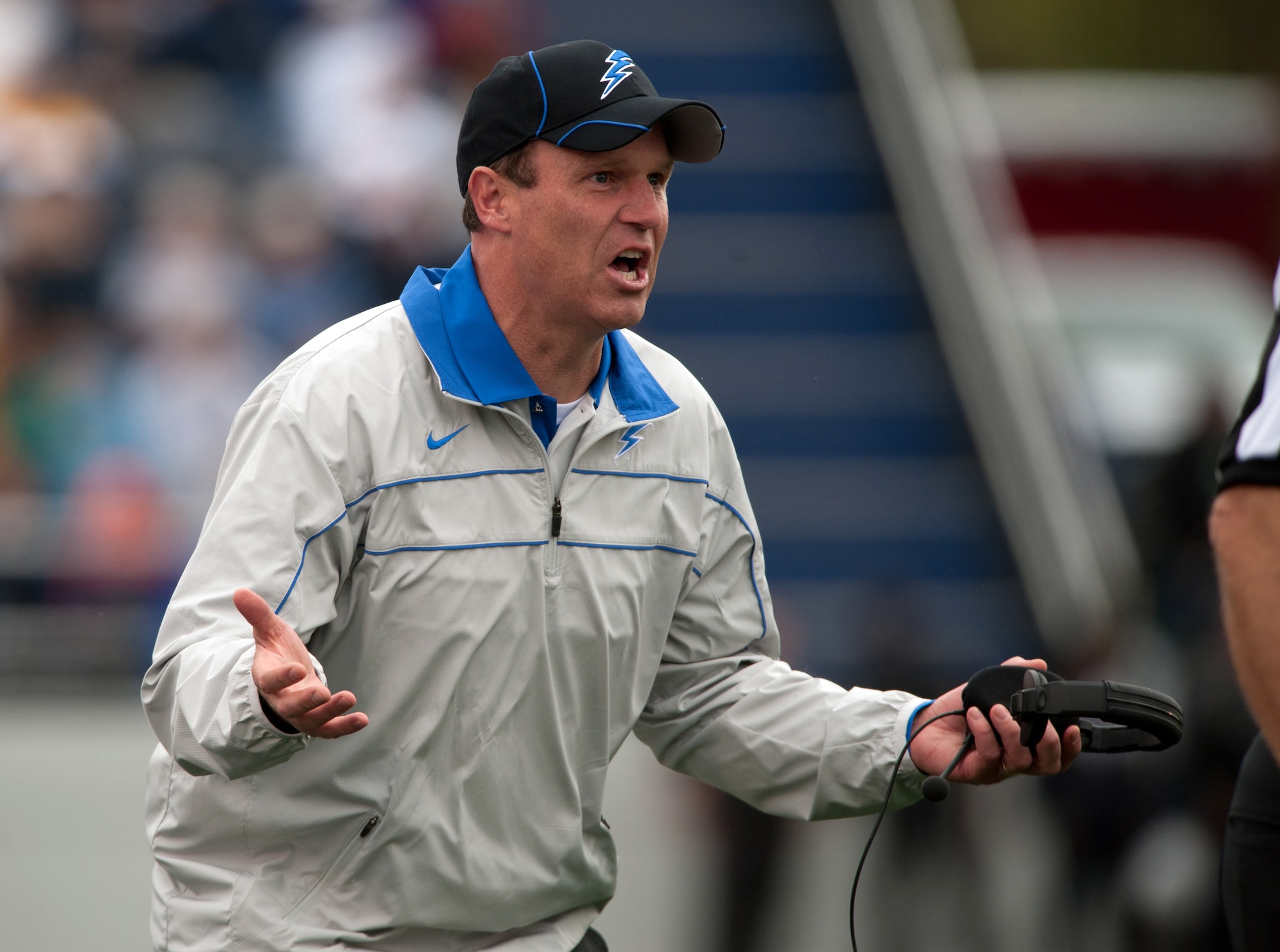 Air Force coach Troy Calhoun tries to motivate his team as the Falcons take on the Midshipmen of Navy Saturday, Oct. 1, 2011 at the Naval Academy's Jack Stephens Field. The Falcons dominated the first half, but almost let go of the game in the second after the Mids outscored them 25-7. The Falcons won 35-34 in overtime after the Mids kicker Jon Teague missed their point after attempt.  (U.S. Air Force photo/Russ Scalf)