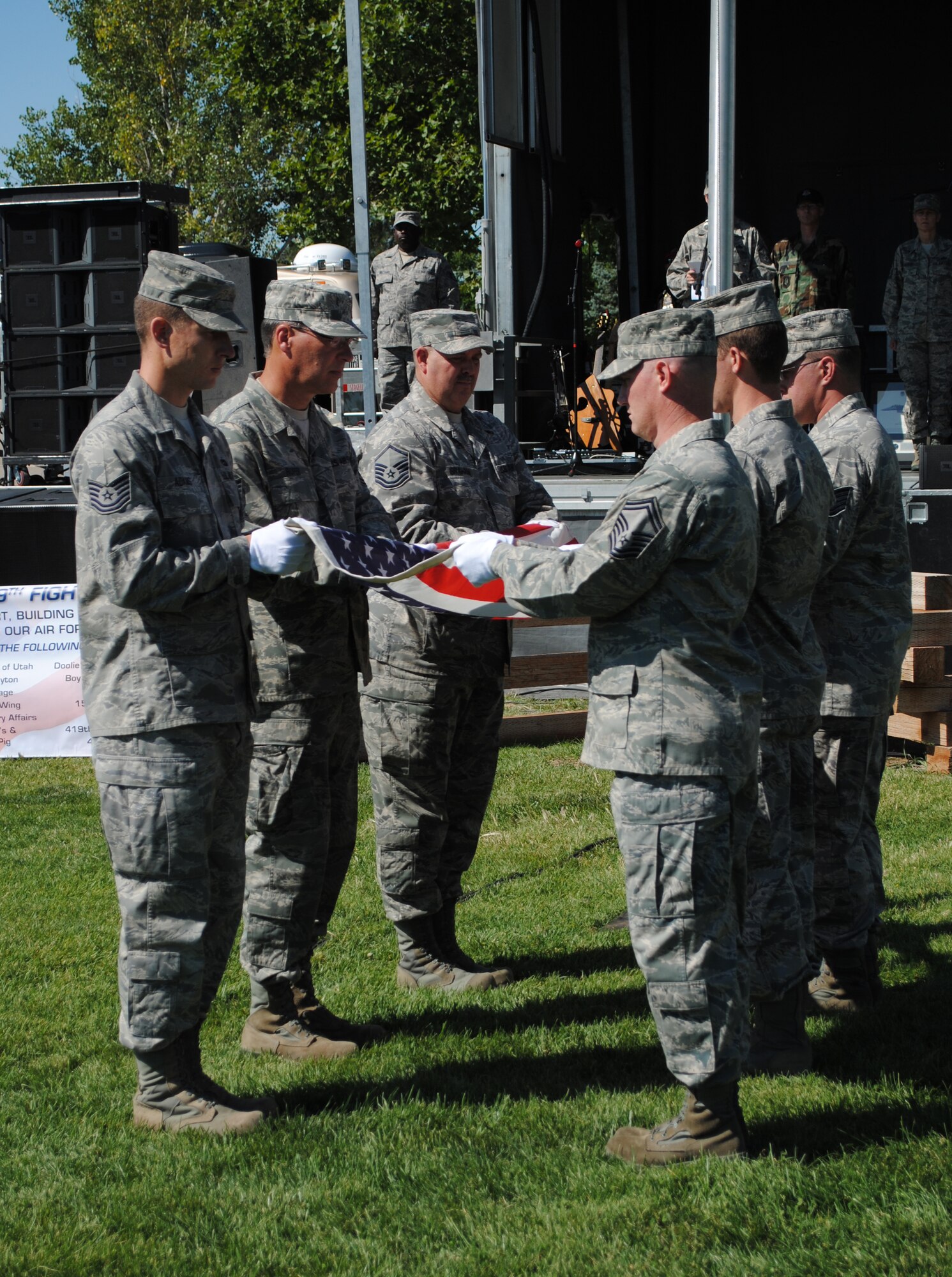 The wing’s honor guard folds an old flag so it can be retired. (U.S. Air Force photo/Airman 1st Class Crystal Charriere)
