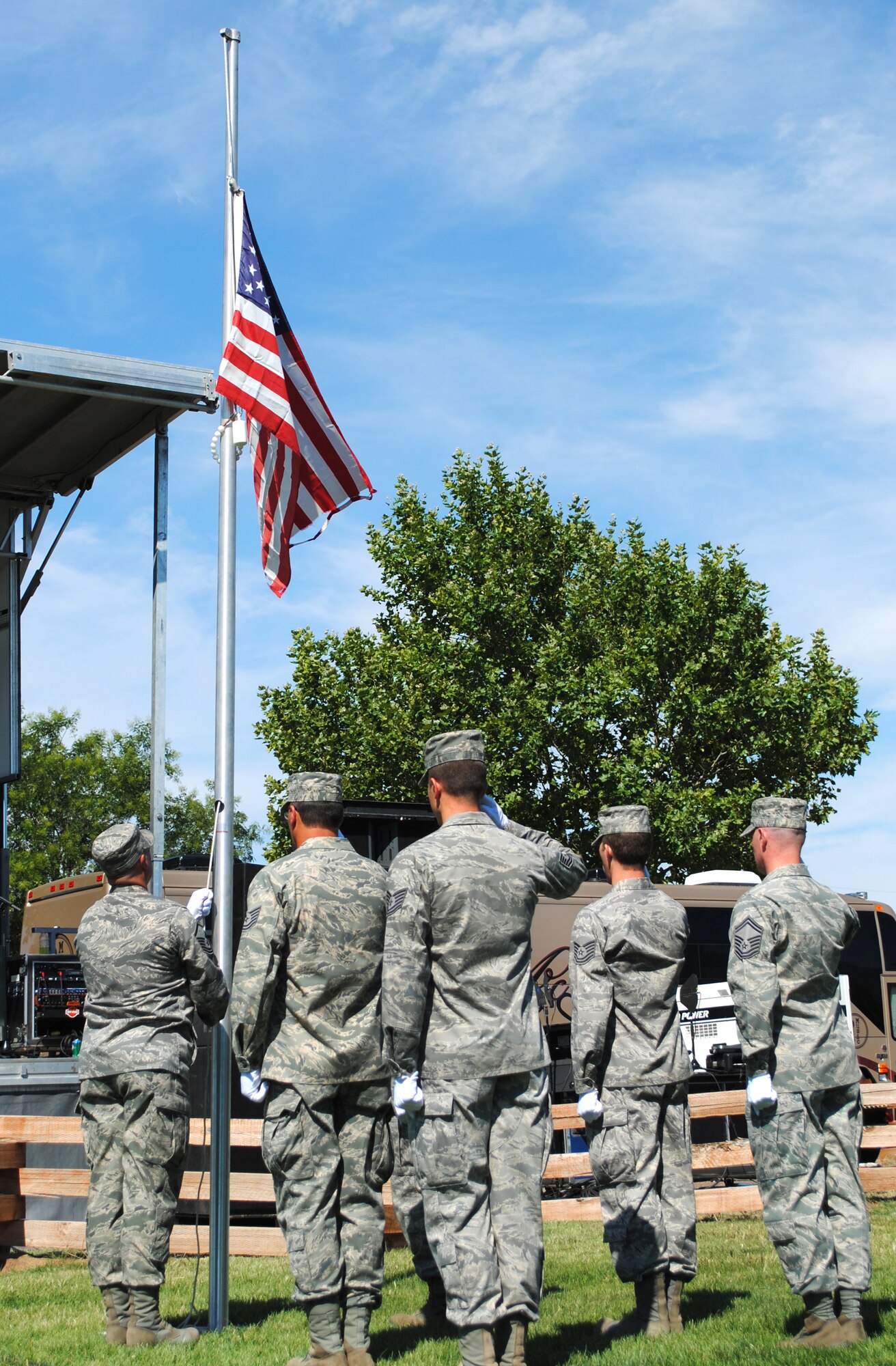 The 419th Fighter Wing’s honor guard lowers a flag that is no longer fit for display. When a flag is tattered and old, the honor guard burns it as part of a flag retirement ceremony. (U.S. Air Force photo/Airman 1st Class Crystal Charriere)