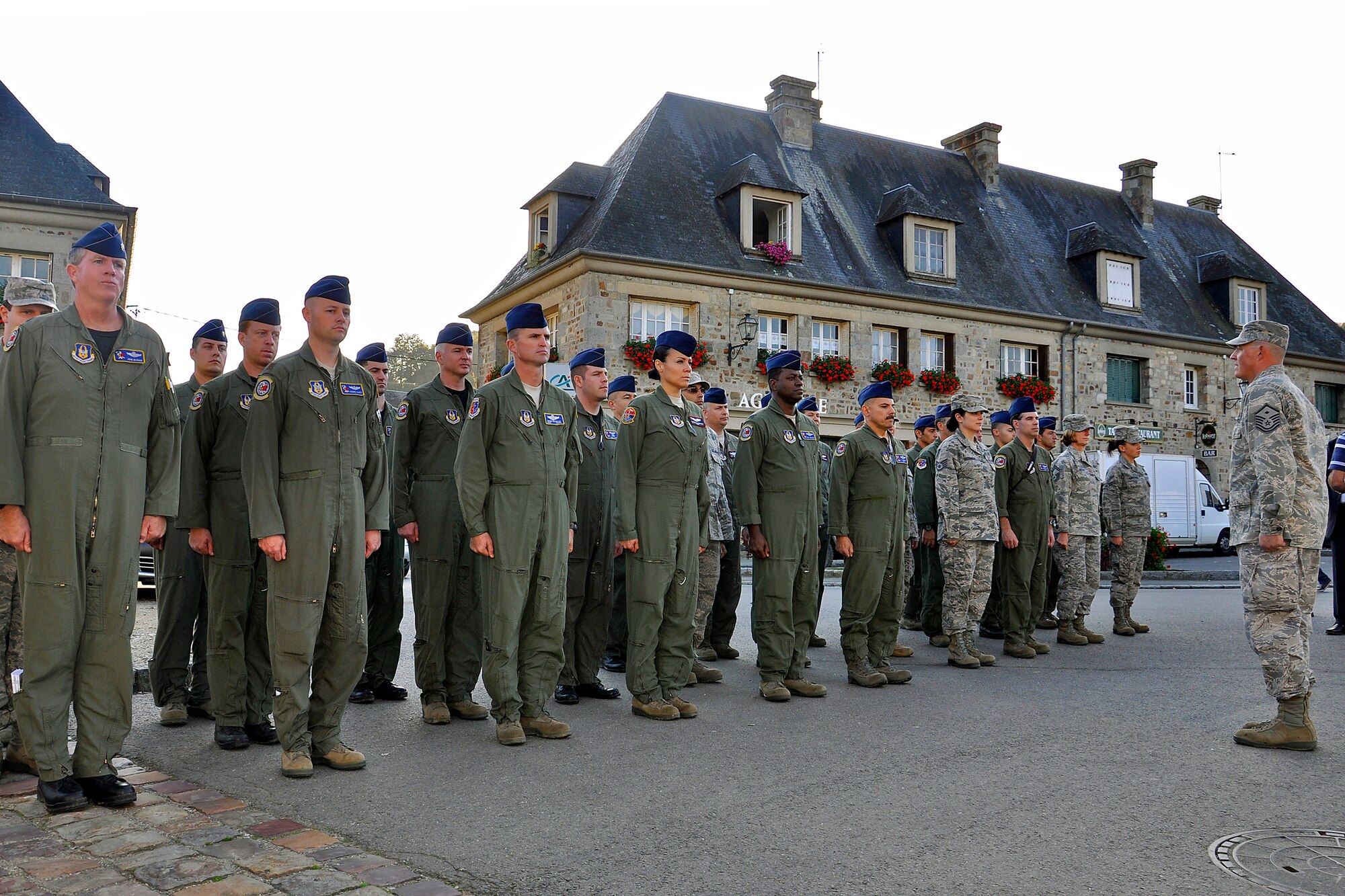 Master Sgt. Chuck Kramer, 732nd Airlift Squadron first sergeant, leads a flight of Airmen in the streets of Lonlay L'Abbaye, France, Sept. 23, 2011. Kramer was part of a contingent of Reserve Airmen from the 514th Air Mobility Wing who repatriated the wreckage of a bomber that crashed in France during World War II. The B-17 Flying Fortress spent more than half a century in a French farmers barn before being turned over to the Airmen. The 514th Air Mobility Wing is stationed at Joint Base McGuire-Dix-Lakehurst, N.J. (Photo by Tech. Sgt. Shawn J. Jones)