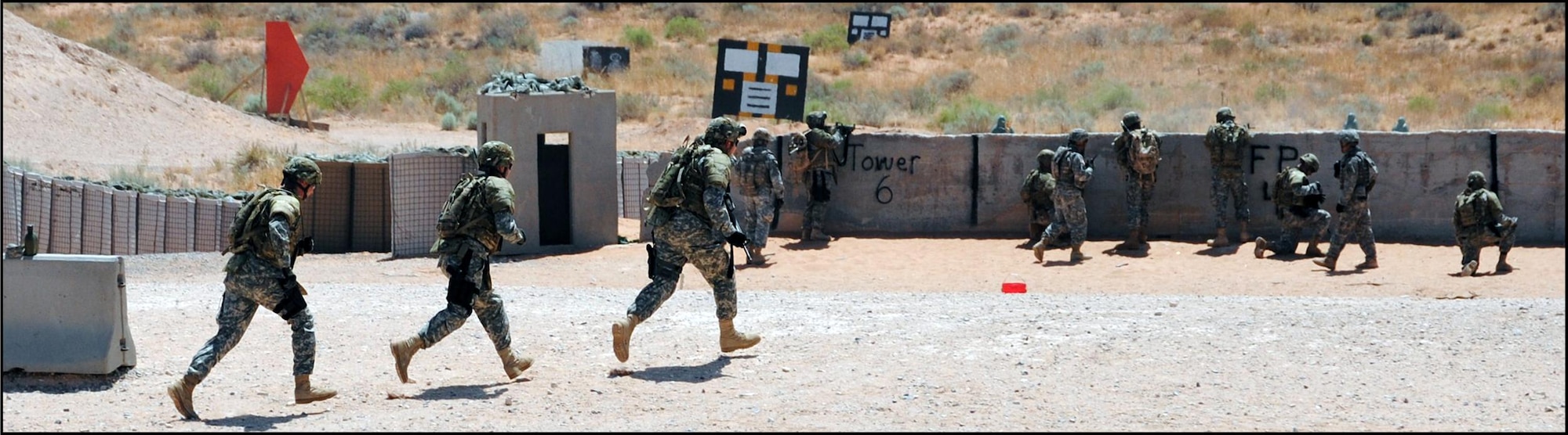 Connecticut Air National Guardsmen with the 103rd Civil Engineer Squadron train as a quick reaction force (QRF) fortifying a strategic position at a training range on Camp McGregor in New Mexico, Aug. 9, 2011. The Guardsmen were there for Combat Skills Training prior to deploying overseas.  (Photo by Lt. Col. Roy V. Walton)