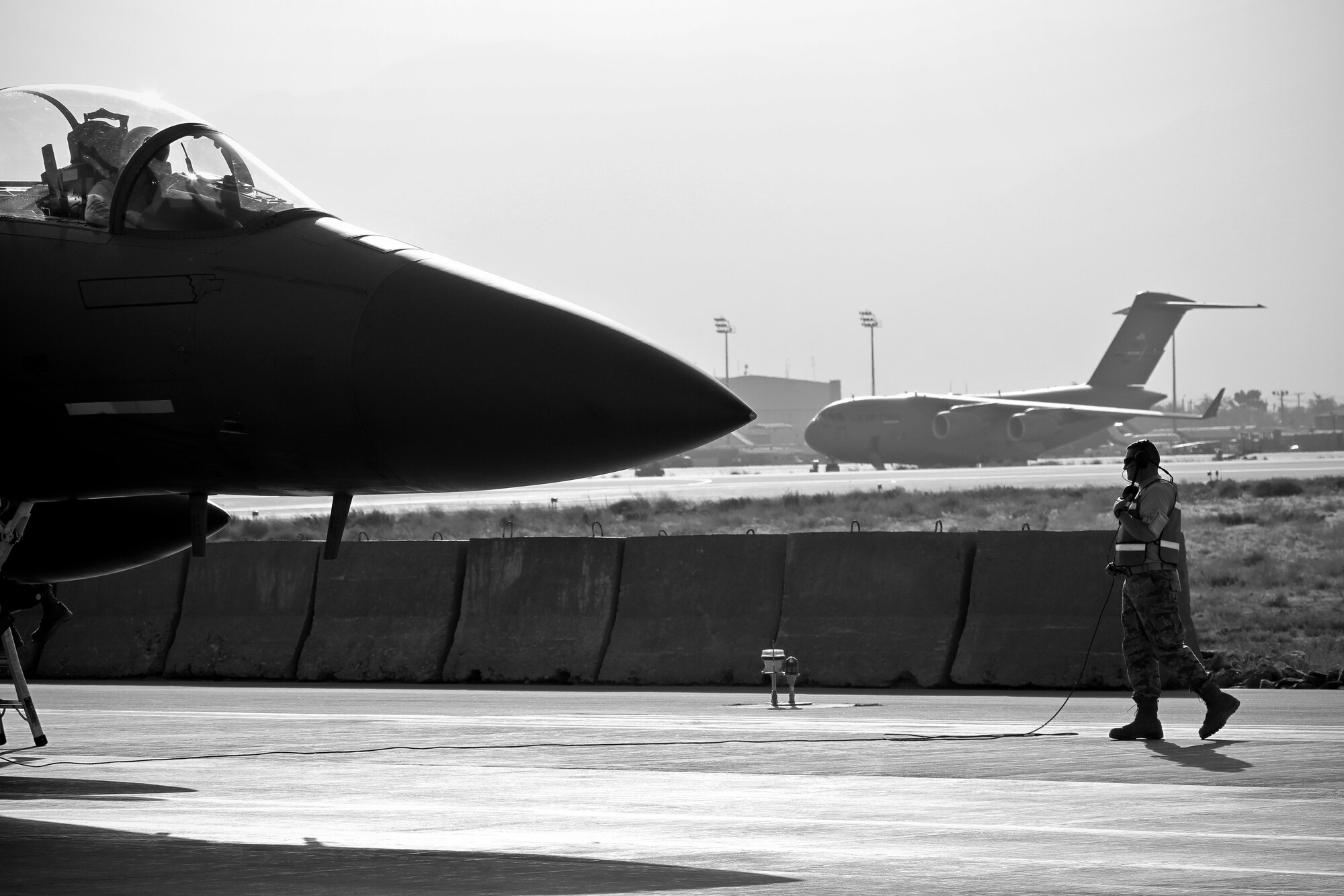 BAGRAM AIRFIELD, Afghanistan -- Tech. Sgt. Jackie Cook, 455th Expeditionary Aircraft Maintenance Squadron crew chief, readies an F-15E Strike Eagle for post flight checks here Sept. 30, 2011. Cook is deployed from Seymour Johnson Air Force Base, N.C.  (U.S. Air Force photo/Tech Sgt. Matt Hecht)
