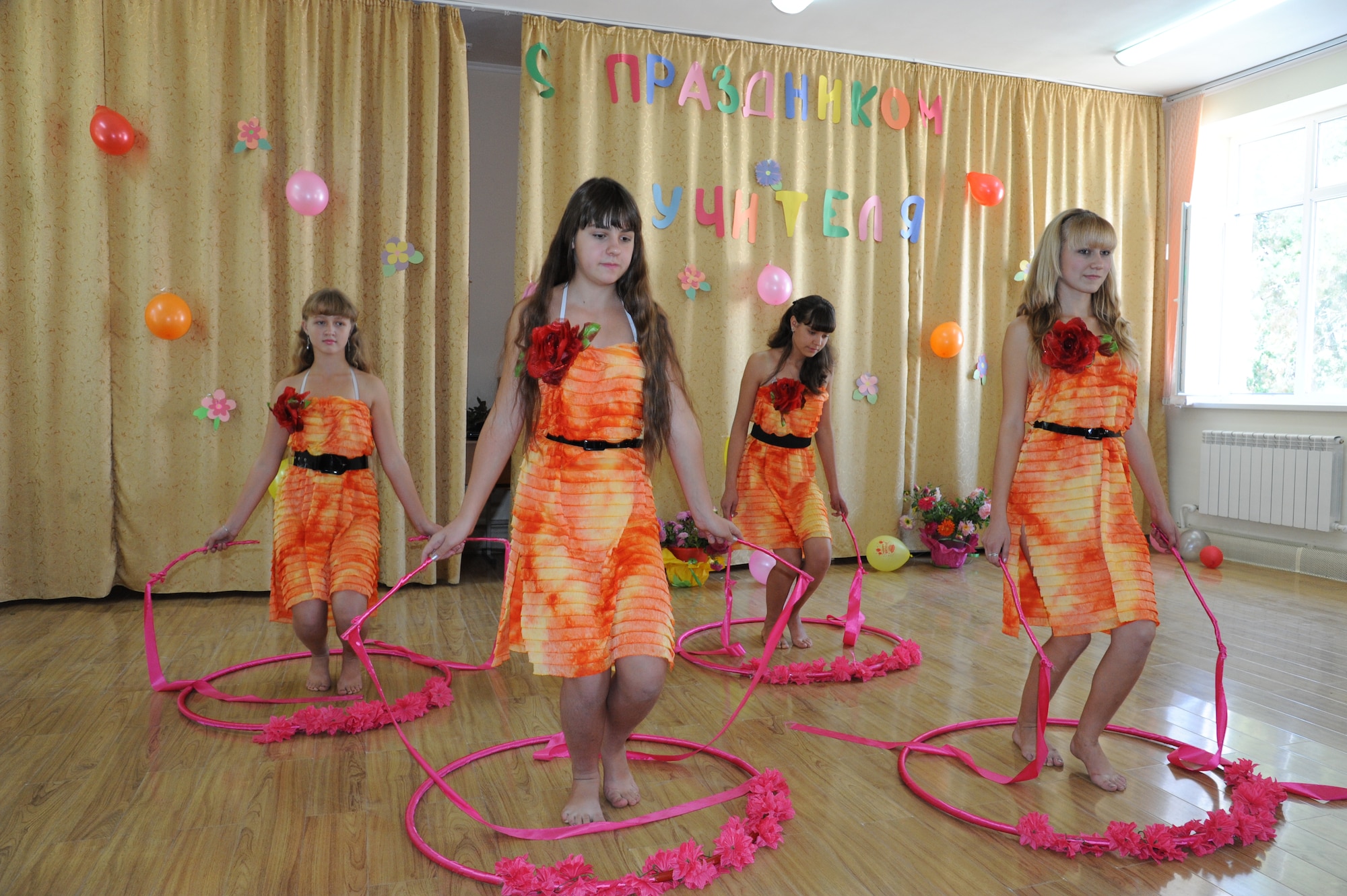 Students at the Birdik School perform a dance routine during Teachers’ Day in Kyrgyzstan Sept. 30. Teacher’s Day is a Kyrgyz Republic holiday recognizing educators and their contributions to the school system. The director of the public school in Birdik, Olga Voroshikhina, invited representatives from the Transit Center at Manas to celebrate Teachers’ Day with her students and faculty. The Birdik School was renovated using Transit Center funds in 2009 after many years of disrepair. The exchange between the school and the Transit Center exemplifies the US government's commitment to strengthening community involvement and partnerships with our hosts in the Kyrgyz Republic. (U.S. Air Force photo/Tech. Sgt. Hank Hoegen)