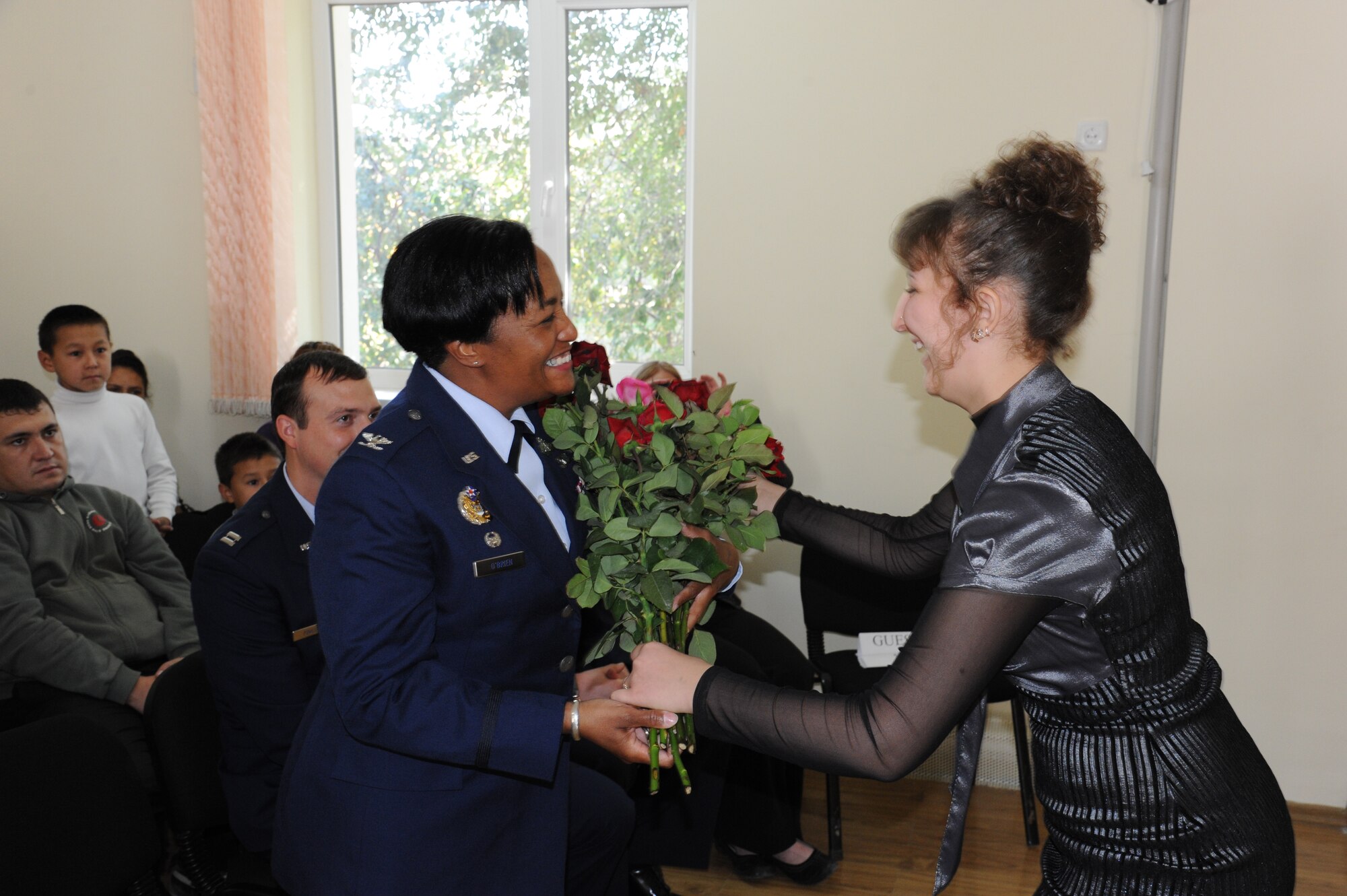 Col. Shawna O’Brien receives flowers from a student after speaking during Teachers’ Day at the Birdik school inBishkek, Kyrgyzstan, Sept. 30. Teachers’ Day is a holiday recognizing educators and their contributions to the school system in the Kyrgyz Republic. O’Brien is assigned to the Transit Center at Manas as the 376th Expeditionary Mission Support Group commander. (U.S. Air Force photo/Tech. Sgt. Hank Hoegen)