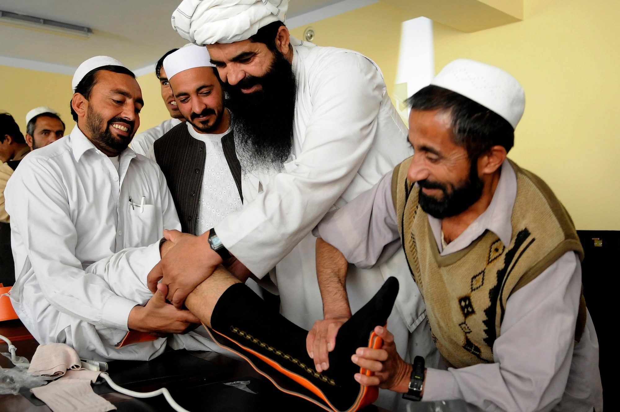 Doctors from the Jaji district hospital, Paktya Province, Afghanistan, practice placing a splint on another doctor’s leg during a training seminar in Jaji district, Afghanistan, Sept. 28, 2011. Medical care providers received training in trauma, hygiene, performing ultrasounds and various other medical procedures. (U.S. Air Force photo/Senior Airman Wesley Farnsworth)
