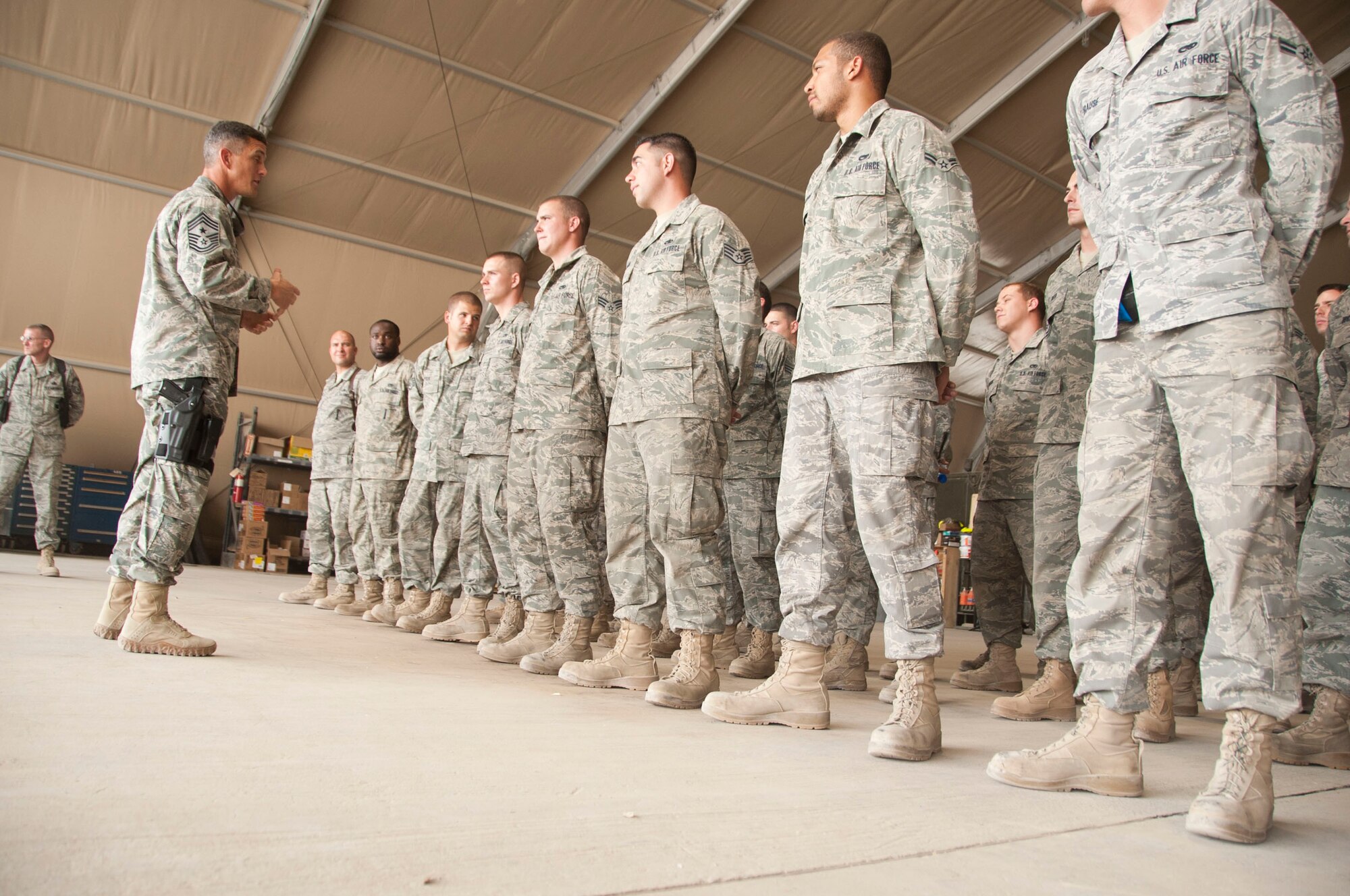 Chief Master Sgt. Richard Parsons, AFCENT command chief, speaks to deployed Airmen at Kandahar Airfield, Afghanistan, Sept. 24, 2011. The Airmen are assigned to the 74th Expeditionary Aircraft Maintenance Squadron and the 74th Expeditionary Maintenance Squadron. (U.S. Air Force photo by Senior Airman Corey Hook)