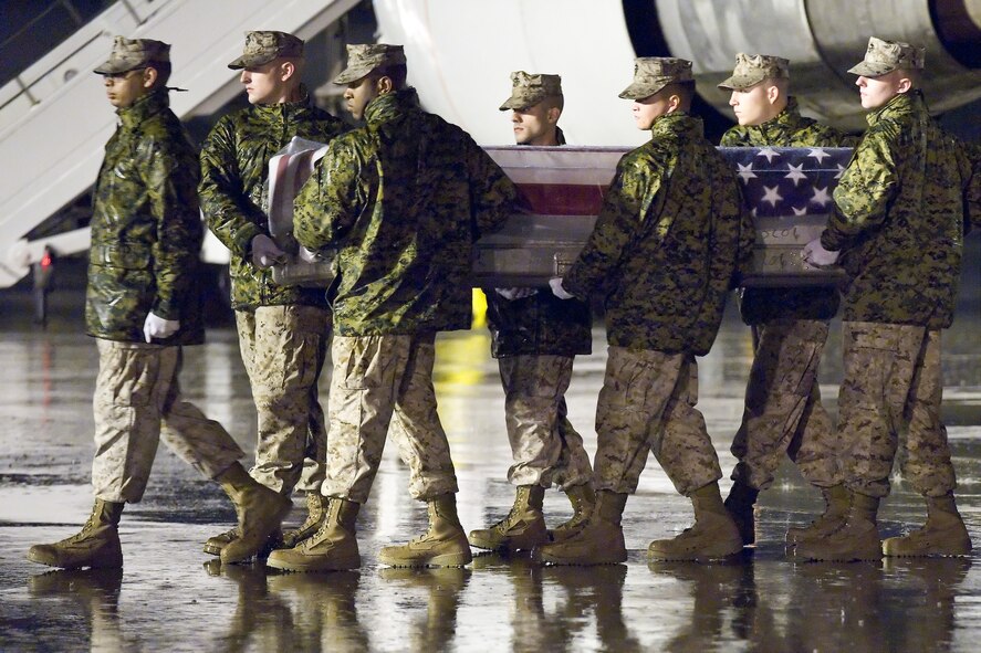 A U.S. Marine Corps carry team transfers the remains of Marine 1st Lt. Ryan K. Iannelli, of Clarksboro, N.J., at Dover Air Force Base, Del., Sept. 30, 2011. Iannelli was assigned to Marine Light Attack Helicopter Squadron 269, Marine Air Group 29, 2nd Marine Air Wing, II Marine Expeditionary Force, Marine Corps Air Station New River, N.C. (U.S. Air Force photo/Roland Balik)