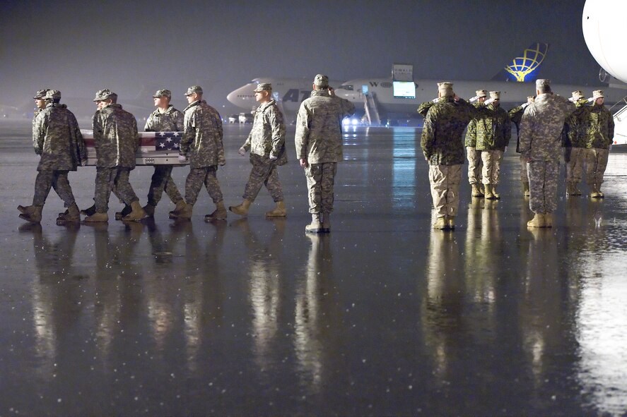 A U.S. Army carry team transfers the remains of Army Spc. Steven E. Gutowski, of Plymouth, Mass., at Dover Air Force Base, Del., Sept. 30, 2011. Gutowski was assigned to the 5th Engineer Battalion, 4th Maneuver Enhancement Brigade, Fort Leonard Wood, Mo. (U.S. Air Force photo/Roland Balik)
