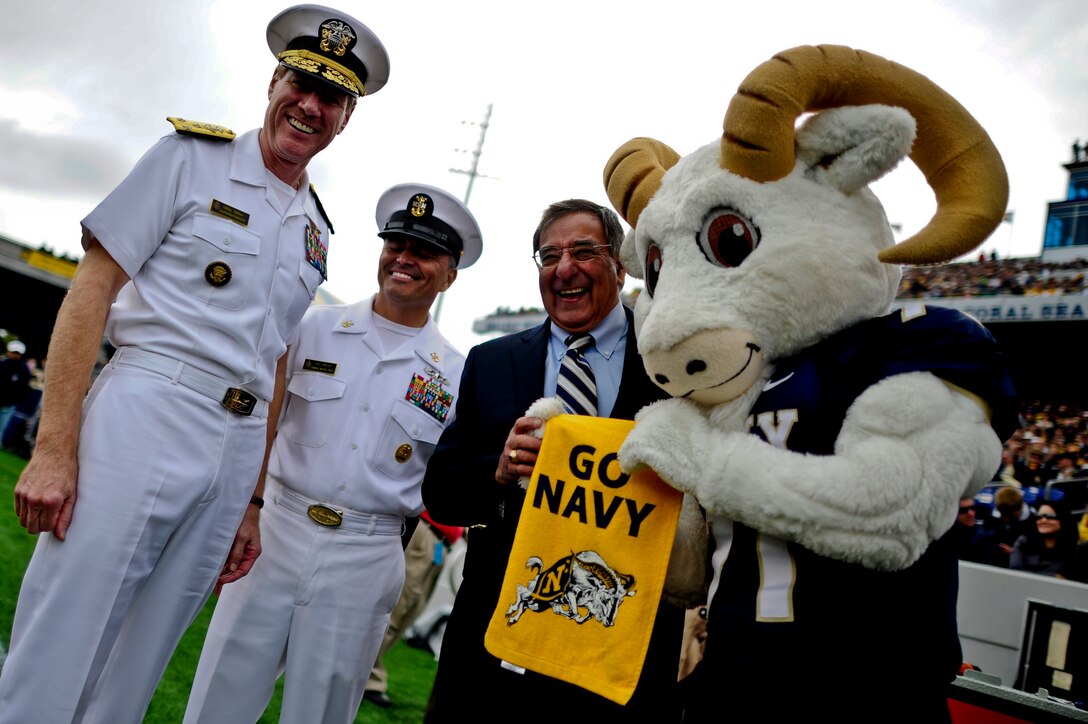 Defense Secretary Leon E. Panetta meets with U.S. Naval Academy superintendent Vice Adm. Michael H. Miller, left, Command Master Chief Jon R. Taylor and academy mascot Bill the Goat before the Air Force vs. Navy football game at the at the Navy-Marine Corps Memorial Stadium in Annapolis, Md., Oct. 1, 2011. 