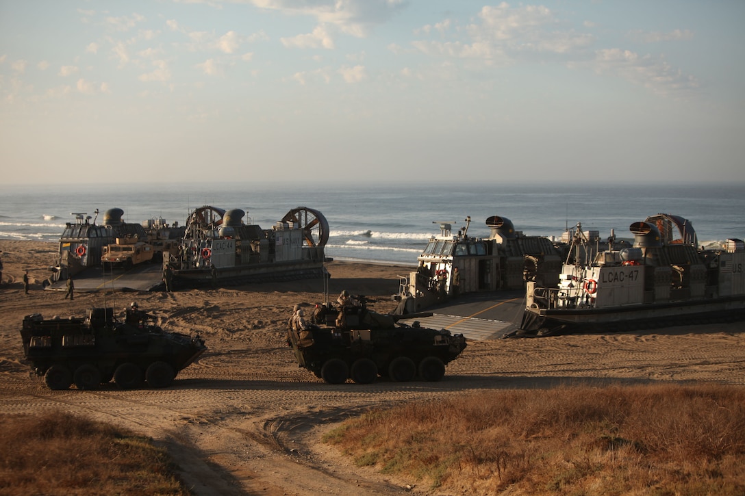 Light-armored vehicles with Battalion Landing Team 3/1, arrive here to provide security Oct. 1 during a humanitarian assistance exercise. Marines and sailors embarked the amphibious assault ship Makin Island, the amphibious transport dock New Orleans and the dock landing ship Pearl Harbor in San Diego Sept. 28. The unit is participating in its final exercise before deploying in November.