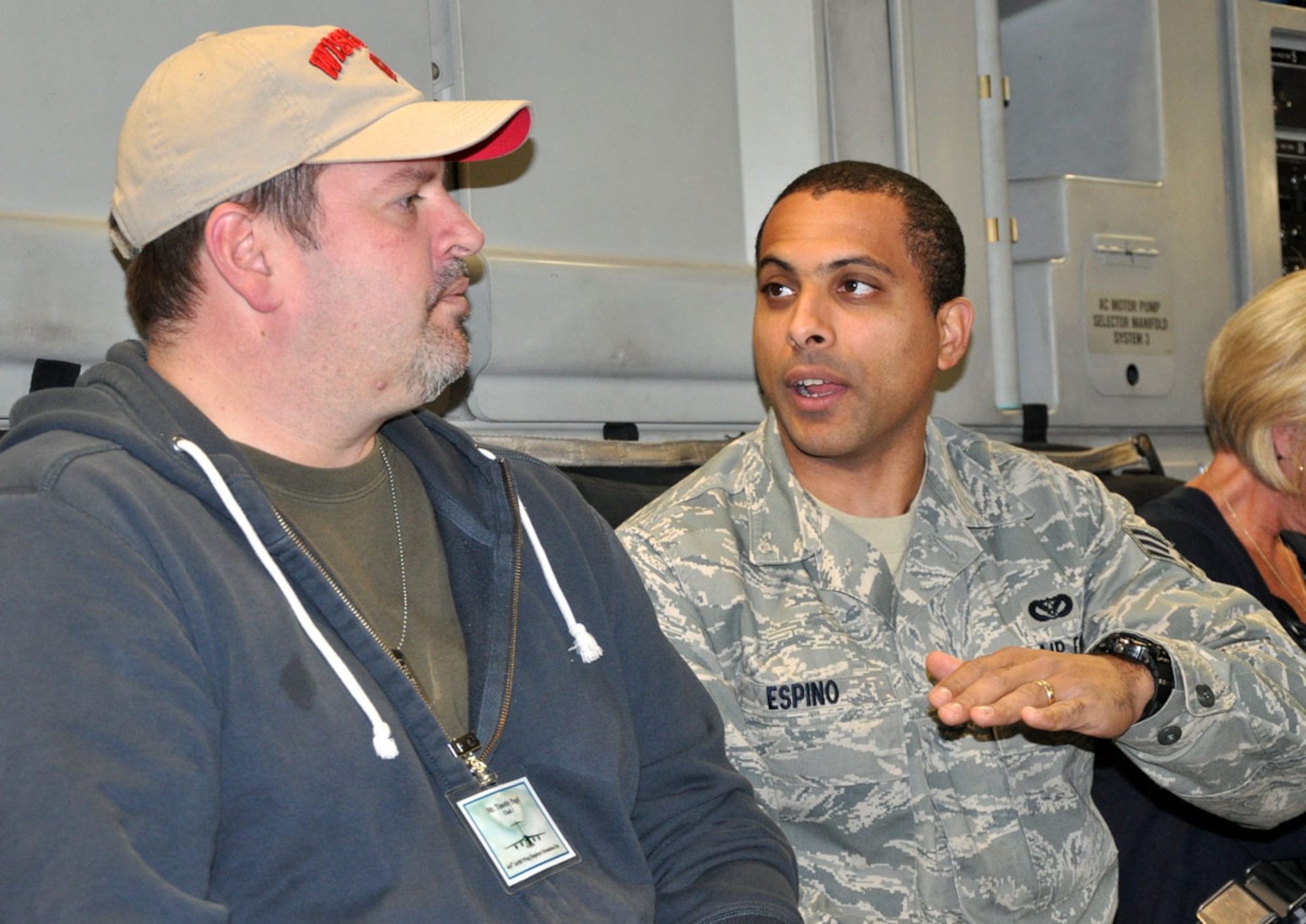 U.S. Air Force Senior Airman Jose Espino, a Reservist with the 446th Civil Engineer Squadron, imparts some of his knowledge with Jim Pagel, the assistant vice president of JP Morgan Chase homeownership center in Lakewood, Wash. during an orientation flight aboard a C-17 Globemaster III aircraft assigned to the 446th Airlift Wing on Oct. 1, 2011. Pagel is Airman Espino's civilian supervisor and was invited on the flight as part of the wing's Employer Orientation Day, a biannual event designed to foster a strong relationship between civilian employers and the Air Force Reserve. (U.S. Air Force photo/Staff Sgt. Grant Saylor)