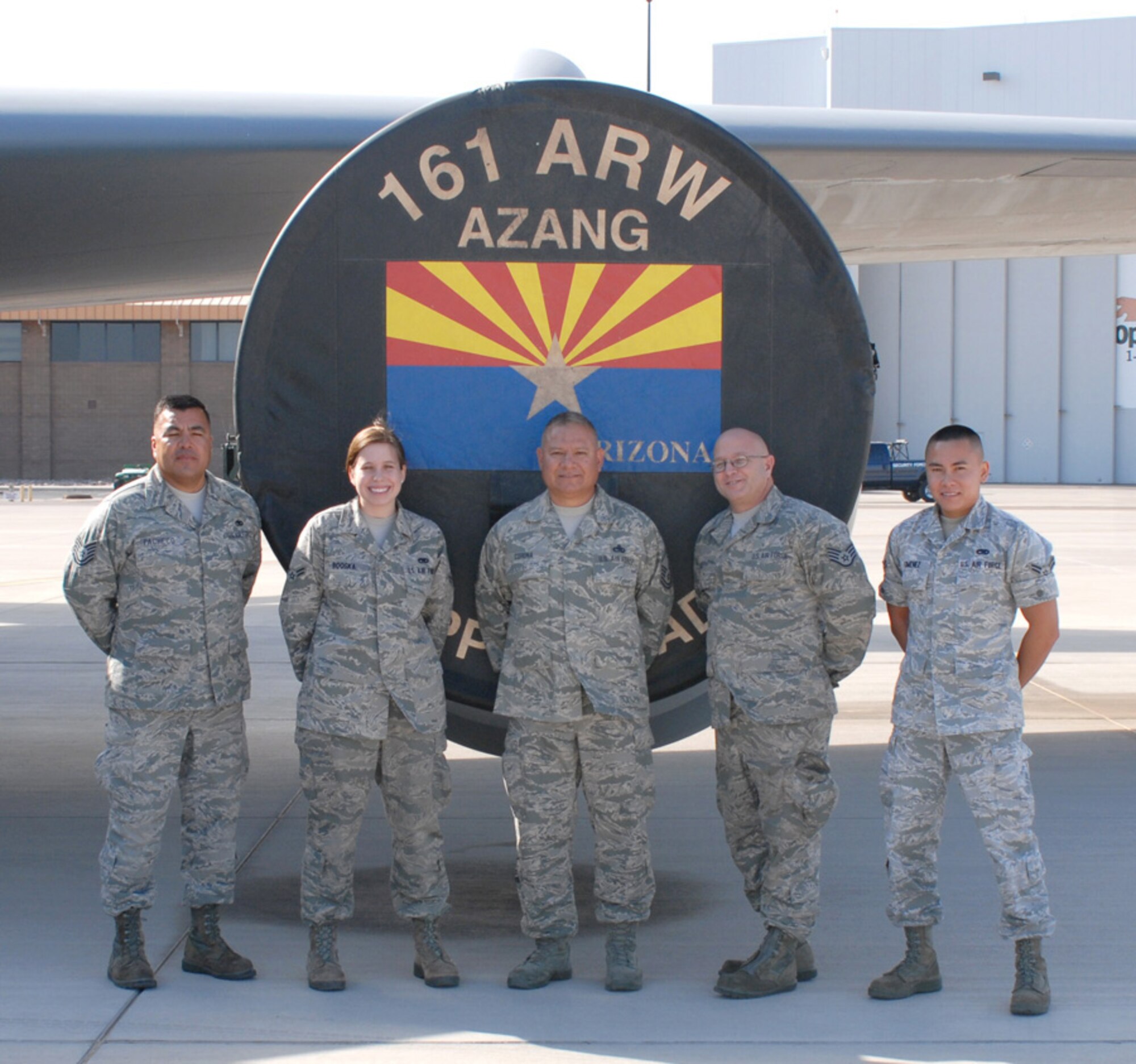 (From left) Technical Sgt. Ramiro Pacheco, Airman 1st Class Jenna Booska , Master Sgt.  Marty Corona, Staff Sgt. David Joseph , and Airman 1st Class Kevin Gimenez, 161st Maintenance Group crew chiefs, stand with their KC-135r, Phoenix, October 2011. This aircraft flew 1,070 flight hours during fiscal year 2011; aside from air refueling, missions include transporting passengers and cargo, proving to be a major contributor to mission success. (Air Force photo by A1C Rashaunda Williams/Released)