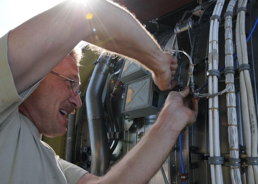 Master Sergeant Patrick Greenwood, 161st Maintenance Group engine mechanic, changes out the ignition exciter box on a KC-135r as part of a routine maintenance inspection, Phoenix, Oct. 1, 2011. This scheduled maintenance includes checking all four engines, changing filters and ensuring there aren’t any oil or fuel leaks. (U.S. Air Force Photo by Staff Sgt. Courtney Enos/Released)