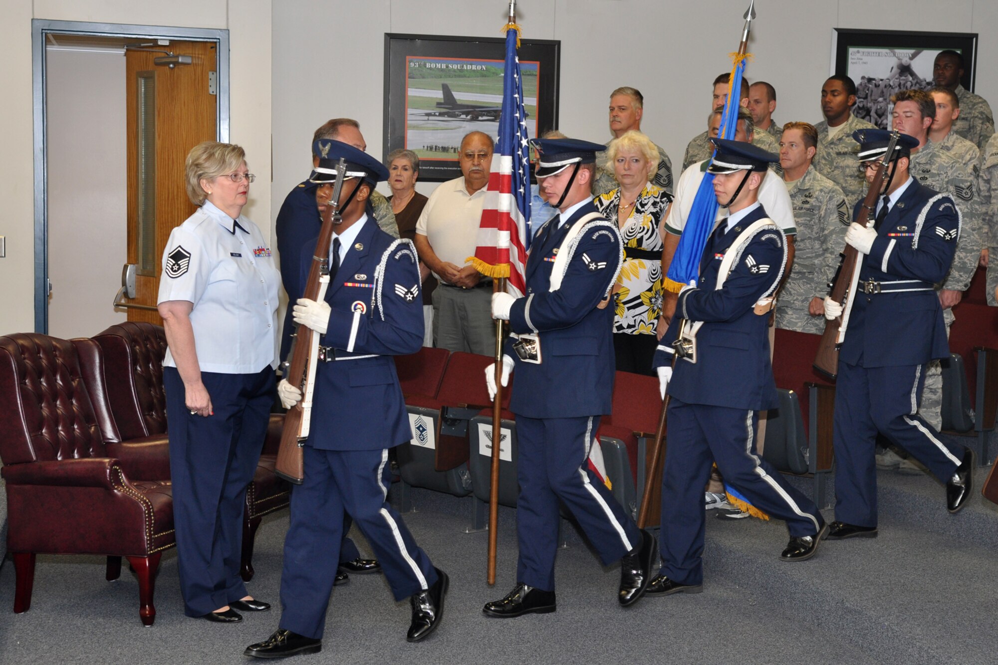 Master Sgt. Naomi Soliday, 307th Civil Engineer Squadron, watches as the Barksdale Air Force Base Honor Guard posts the colors during her retirement ceremony at the 307th Bomb Wing headquarters building, Oct. 1, 2011. (U.S. Air Force photo by Master Sgt. Jeff Walston/Released) 