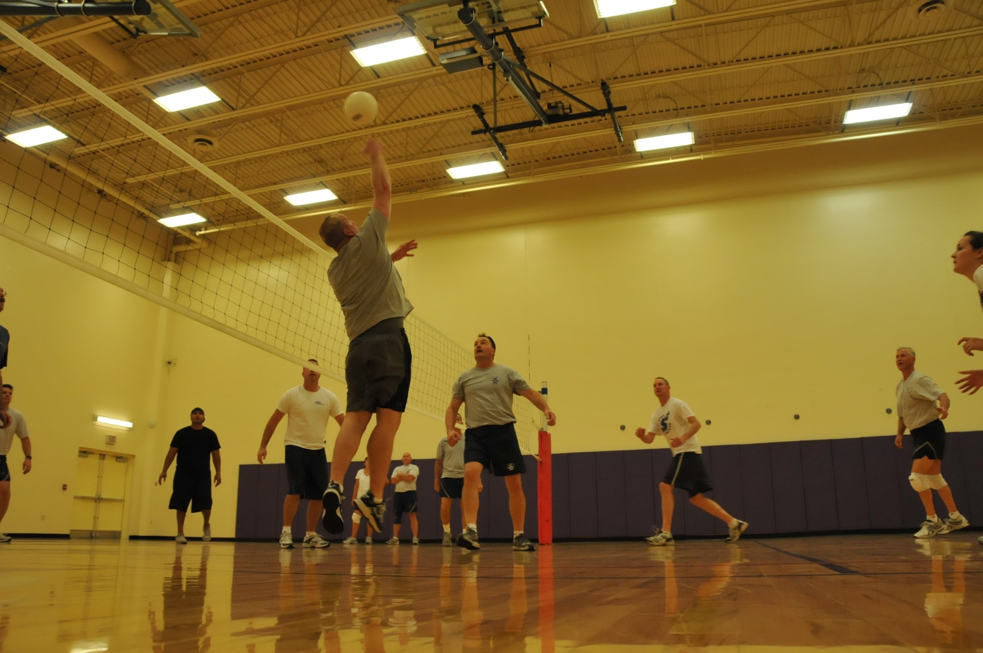 Senior Master Sgt. Rex Smith, sustainment services flight superintendent, goes up for a spike in a volleyball tournament at the base gym during the October UTA.  (Air Force photo/TSgt. Jim Loehr)