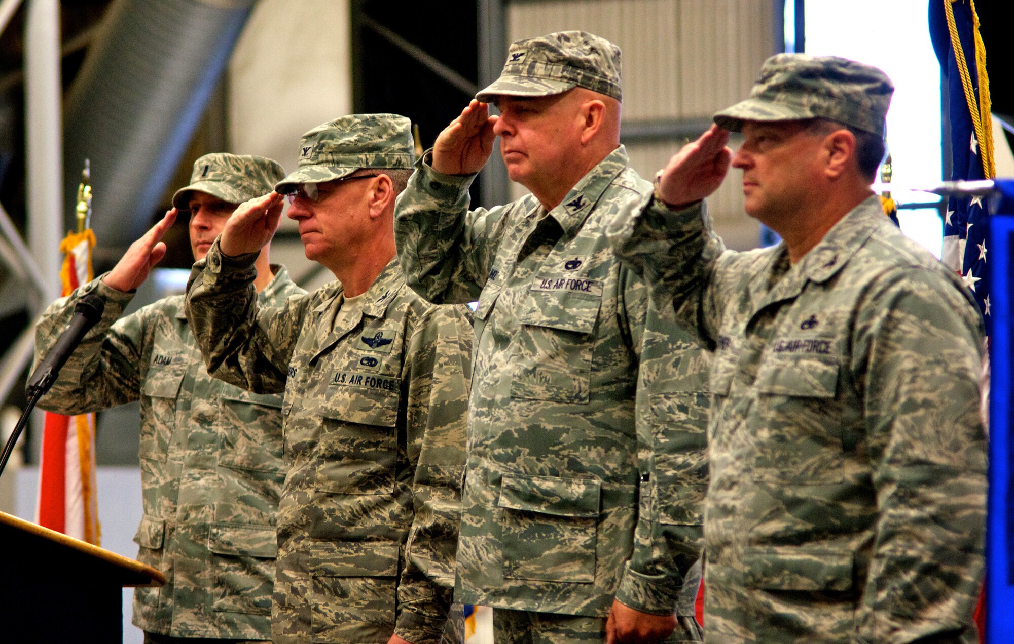 Leadership from the 446th Airlift Wing honor the colors during the 446th Maintenance Group change of command ceremony, Oct. 1, 2011 at McChord Field, Wash. (Pictured from left to right), First Lt. Jared Adam, 446th Maintenance Squadron, Col. Bruce Bowers, 446th Airlift Wing commander, Col. William Anholt, former 446th MXG commander, and Col. Alan Lerner, 446th MXG commander were part of the ceremony where Anholt relinquished his command of the group to Bowers, who bestowed it to Lerner. (U.S. Air Force photo by Staff Sgt. Newton Nagata)