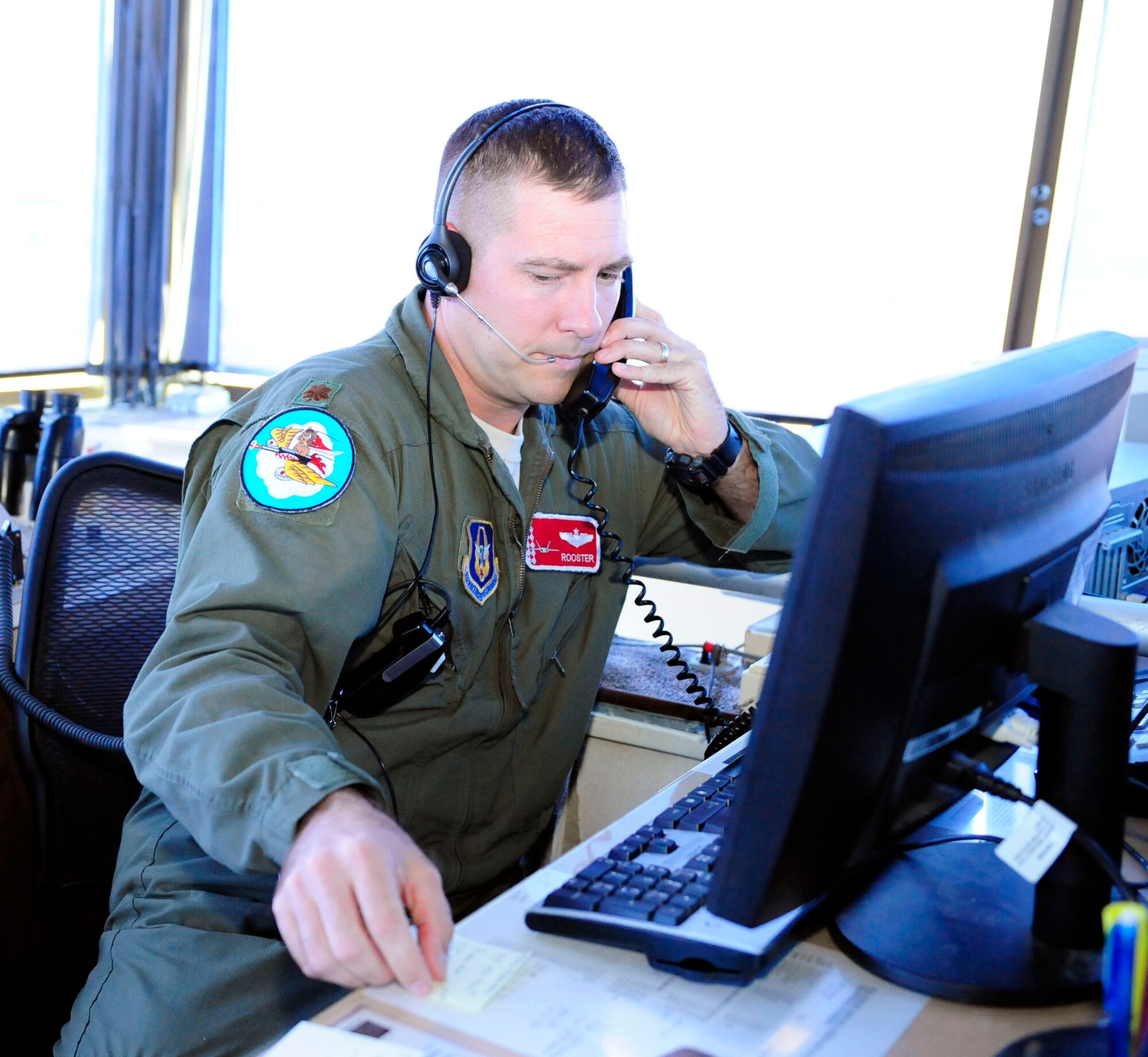 Maj. Jesse Colwell mans Holloman's air traffic control tower Oct. 1. The 44th Fighter Group resumed flight operations after an Air Force wide grounding of F-22s. 