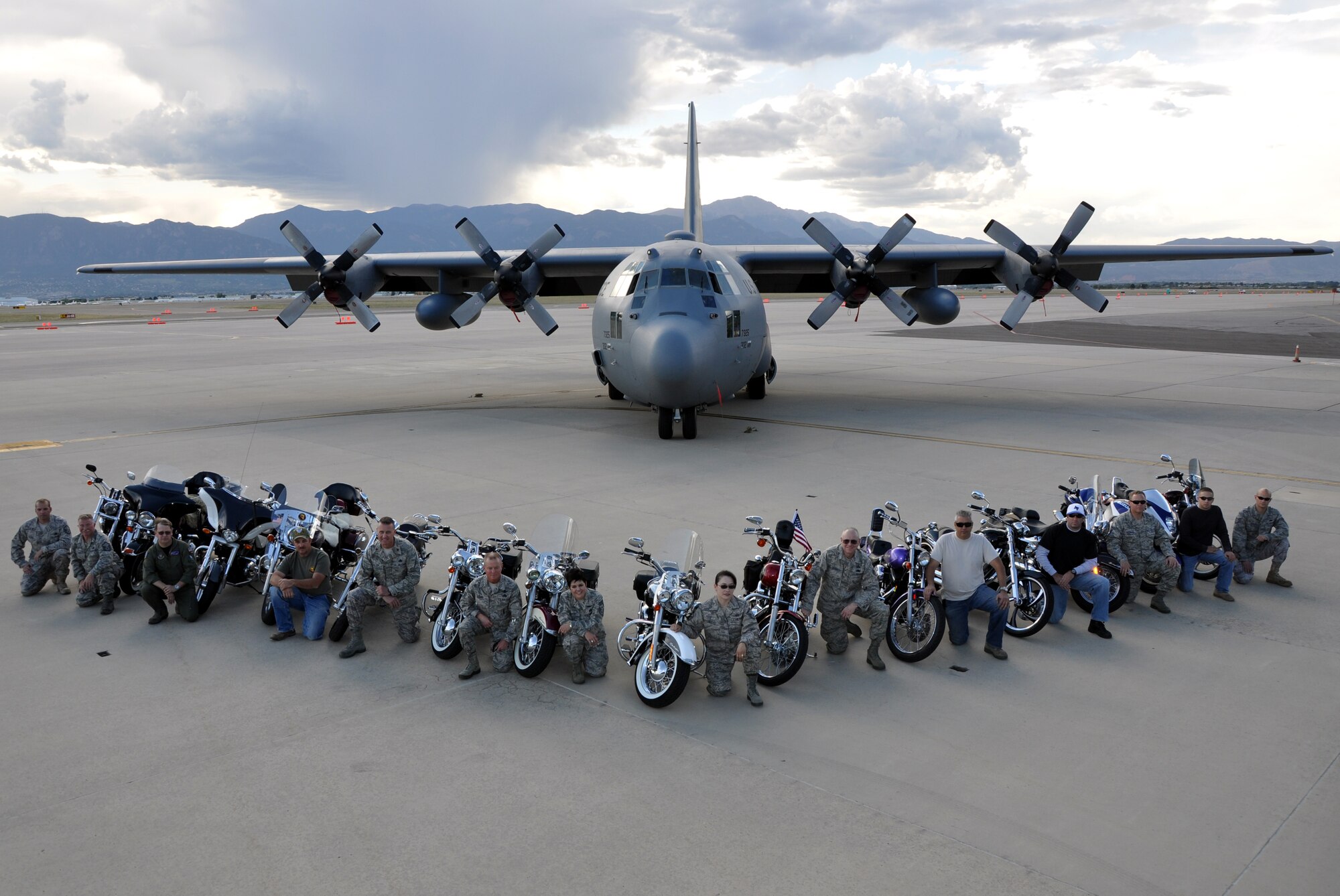 Members of the 302nd Airlift Wing and the 731st Airlift Squadron motored their bikes onto the flight line for the first "Hercs and hogs" event.  On Oct. 1, after duty hours the "Airmen bikers" gathered in front of a mighty Herc for a photo opportunity that showcased their love of their bike and their love of the C-130. (U.S. Air Force photo/Tech. Sgt. Peter Dean)