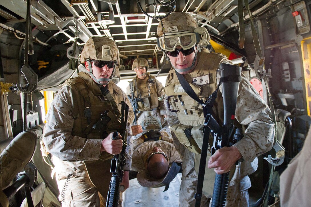 Marines with Combat Logistics Battalion 11 carry a simulated casualty into a Ch-53E Sea Stallion during a casualty evacuation exercise here Oct. 2. The battalion is the logistics combat element for the 11th Marine Expeditionary Unit. The unit embarked the amphibious assault ship Makin Island, the amphibious transport dock New Orleans and the dock landing ship Pearl Harbor in San Diego Sept. 28 and is participating in its final exercise before deploying in November.