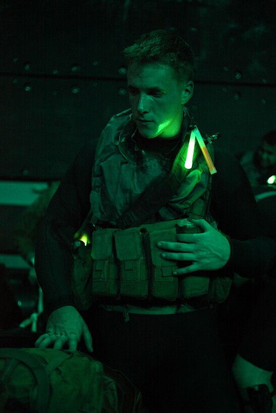 Reconnaissance Marine Cpl. Gerard Coon prepares to leave USS Makin Island for a nighttime exercise here Oct. 2. Coon serves with the 11th Marine Expeditionary Unit, which embarked the amphibious assault ship Makin Island, the amphibious transport dock New Orleans and the dock landing ship Pearl Harbor in San Diego Sept. 28. The unit is participating in its final exercise before deploying in November.