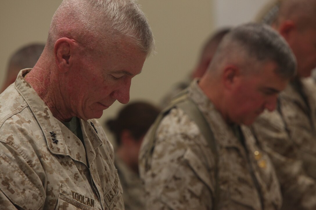 Maj. Gen. John Toolan, left, and Maj. Gen. Glenn Walters bow their heads in prayer at a memorial ceremony for Capt. Ryan Iannelli at the chapel on Camp Dwyer, Afghanistan, Oct. 3. Iannelli, an AH-1W Super Cobra pilot with Marine Light Attack Helicopter Squadron 269, and a native of East Greenwich Township, N.J., died Sept. 28 supporting combat operations in Helmand province, Afghanistan. Toolan is the commanding general of the southwestern regional command of NATO’s International Security Assistance Force and Walters is the commanding general of 2nd Marine Aircraft Wing (Forward).