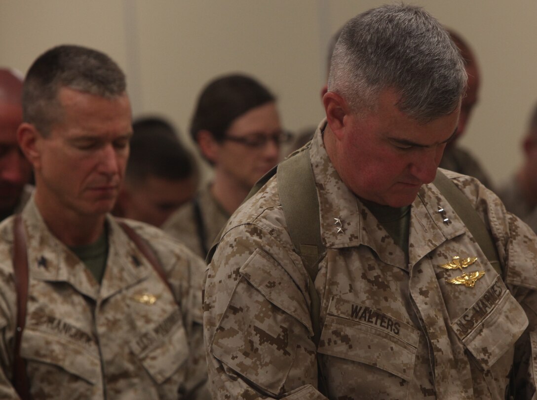 Maj. Gen. Glenn Walters, right, and Col. Ben Hancock bow their heads in prayer at a memorial ceremony for Capt. Ryan Iannelli at the chapel on Camp Dwyer, Afghanistan, Oct. 3. Iannelli, an AH-1W Super Cobra pilot with Marine Light Attack Helicopter Squadron 269, and a native of East Greenwich Township, N.J., died Sept. 28 supporting combat operations in Helmand province, Afghanistan. Walters is the commanding general of 2nd Marine Aircraft Wing (Forward) and Hancock is the assistant wing commander for 2nd Marine Aircraft Wing (Forward).