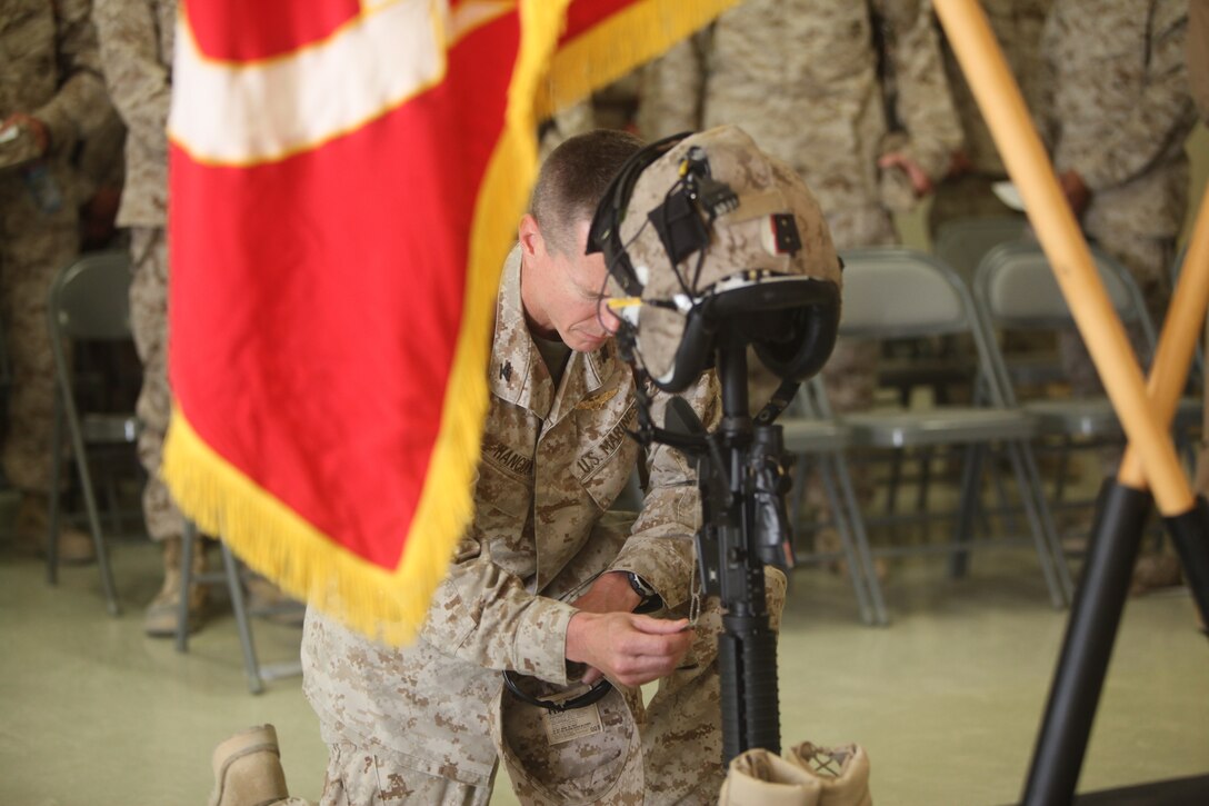Col. Ben Hancock, the assistant wing commander for 2nd Marine Aircraft Wing (Forward), pays his respects to Capt. Ryan Iannelli at the chapel on Camp Dwyer, Afghanistan, Oct. 3. Iannelli, a Super Cobra pilot with the squadron, and a native of East Greenwich Township, N.J., died Sept. 28 supporting combat operations in Helmand province, Afghanistan. “By all accounts, he was extremely well respected and liked – an extremely unique individual who was not just a great aviator, but a great person as well. I got the impression Ryan Iannelli was the kind of guy everyone wanted to hang out with,” Hancock said.
