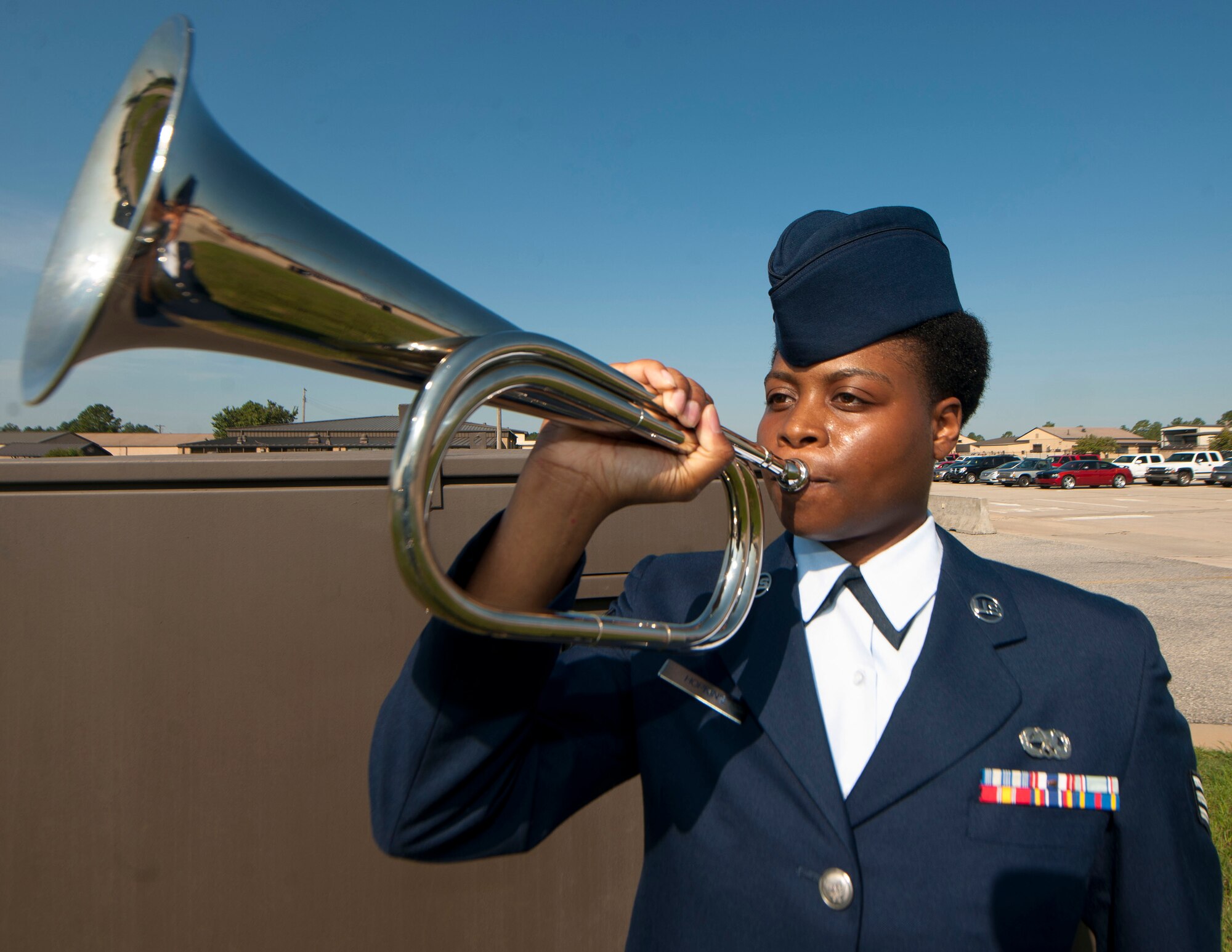 U.S. Air Force Senior Airman Melshondra Hopkins, Moody Air Force Base Honor Guard, sounds the trumpet during a military honors demonstration at Moody AFB, Ga., Sept. 30, 2011. The demonstration showcased what the base honor guard team has learned during their two-week training with the U.S. Air Force Honor Guard team. (U.S. Air Force photo by Airman 1st Class Joshua Green/Released) 
