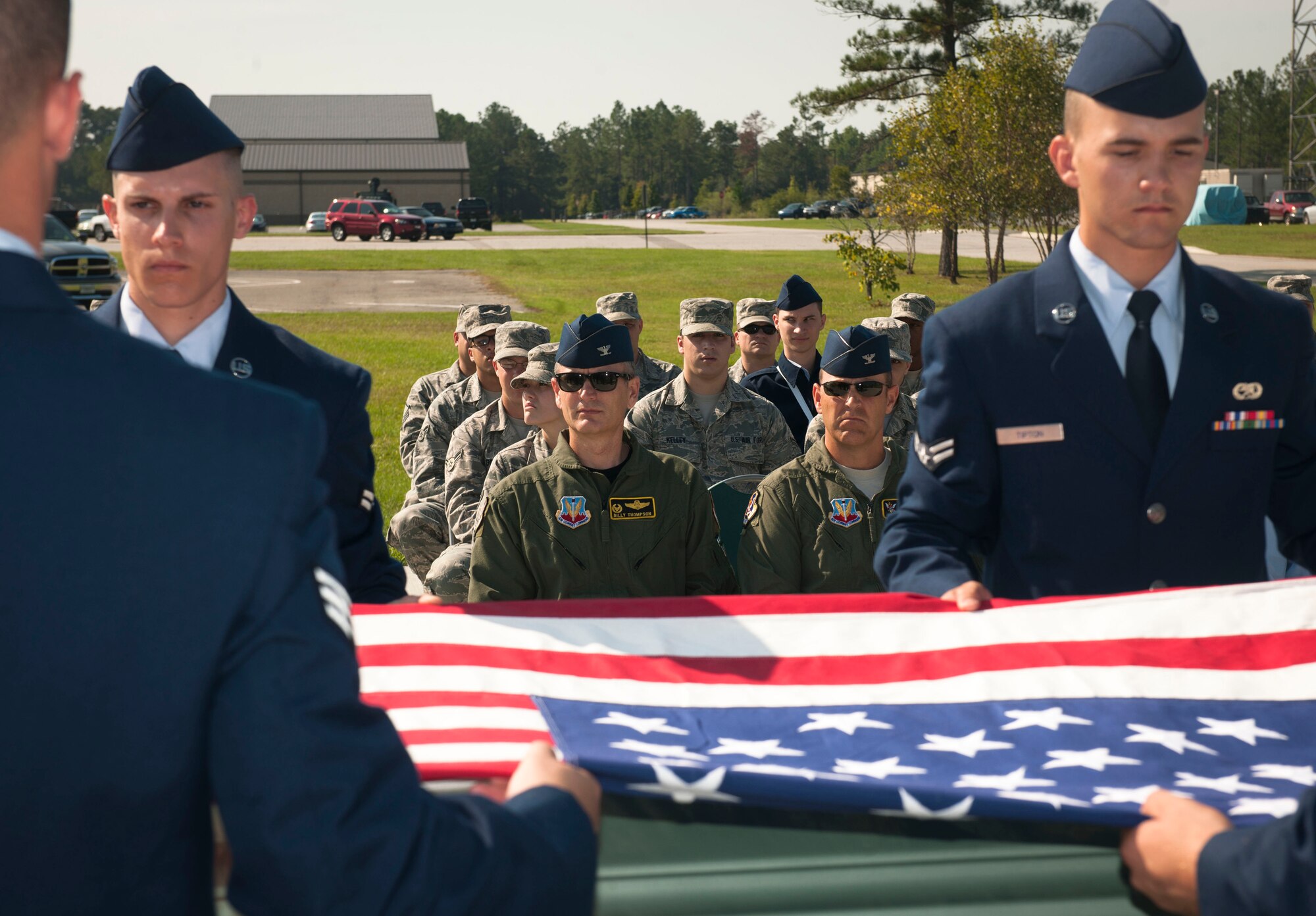 Members of the Moody Air Force Base Honor Guard fold the American flag during a military honors demonstration as base members observe at Moody AFB, Ga., Sept. 30, 2011. The audience included U.S. Air Force Col. Billy Thompson, 23rd Wing commander, and Col. Christopher Short, 23rd WG vice commander, both attended the event to get a first-hand look at the honor guard team after they completed two weeks of training with the U.S. Air Force Honor Guard. (U.S. Air Force photo by Airman 1st Class Joshua Green/Released) 
